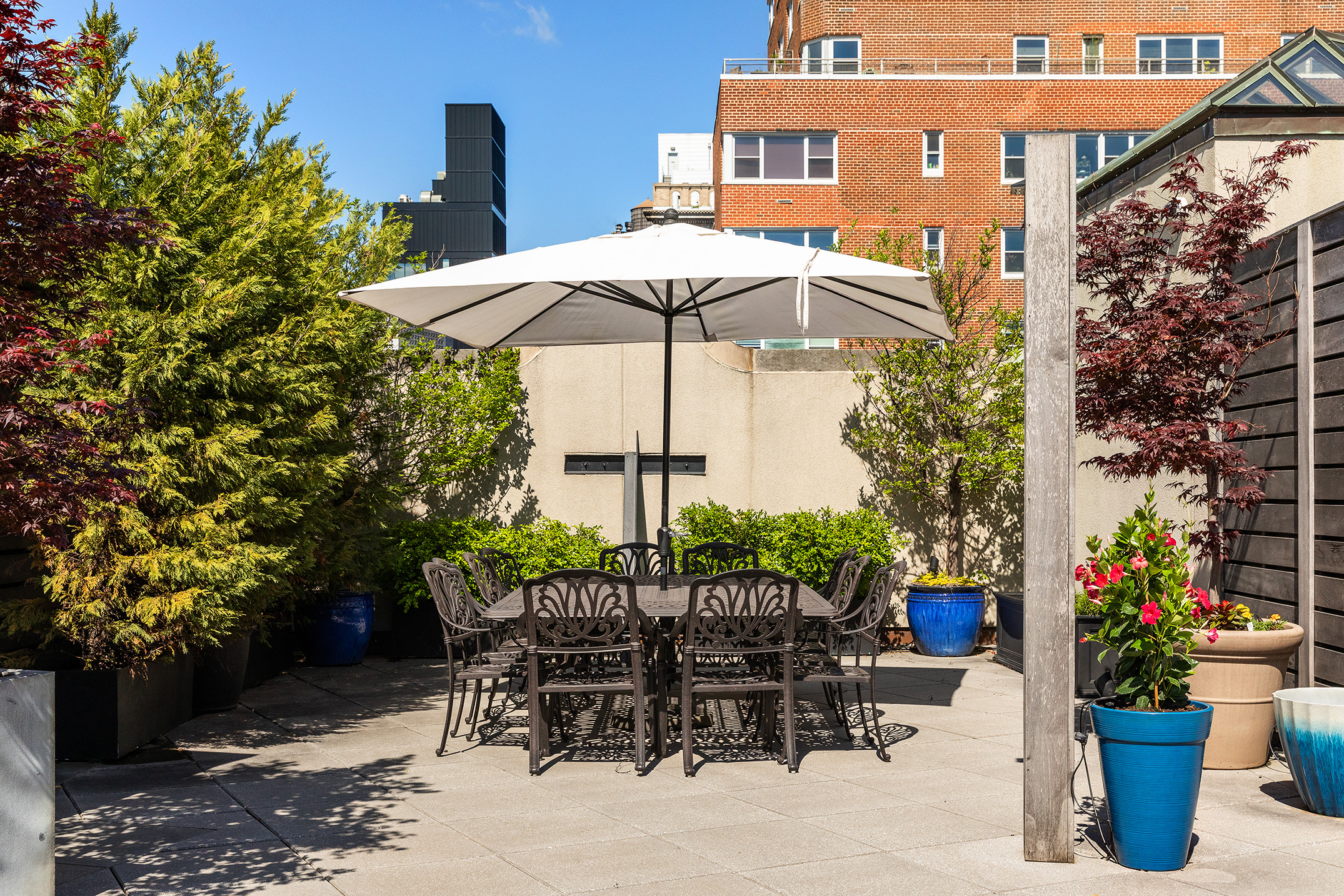115 4th Avenue, Unit 2I Manhattan, NY 10003 - Photo 9 of 12 a view of a chairs and table in backyard