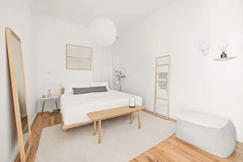 a bedroom with a bed and a table