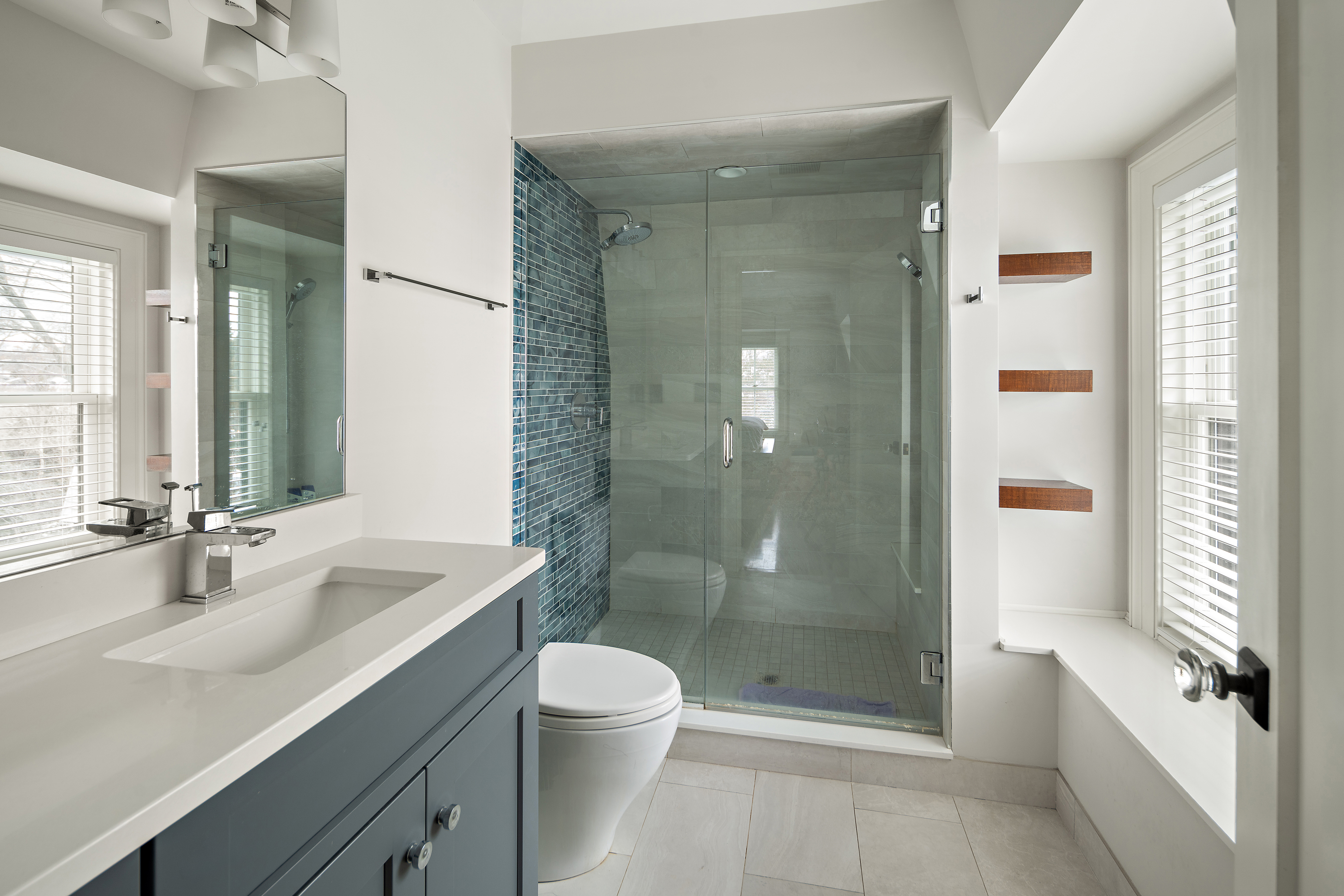 35 Willard Street Cambridge, MA 02138 - Photo 20 of 36 a bathroom with a bathtub shower sink mirror and toilet