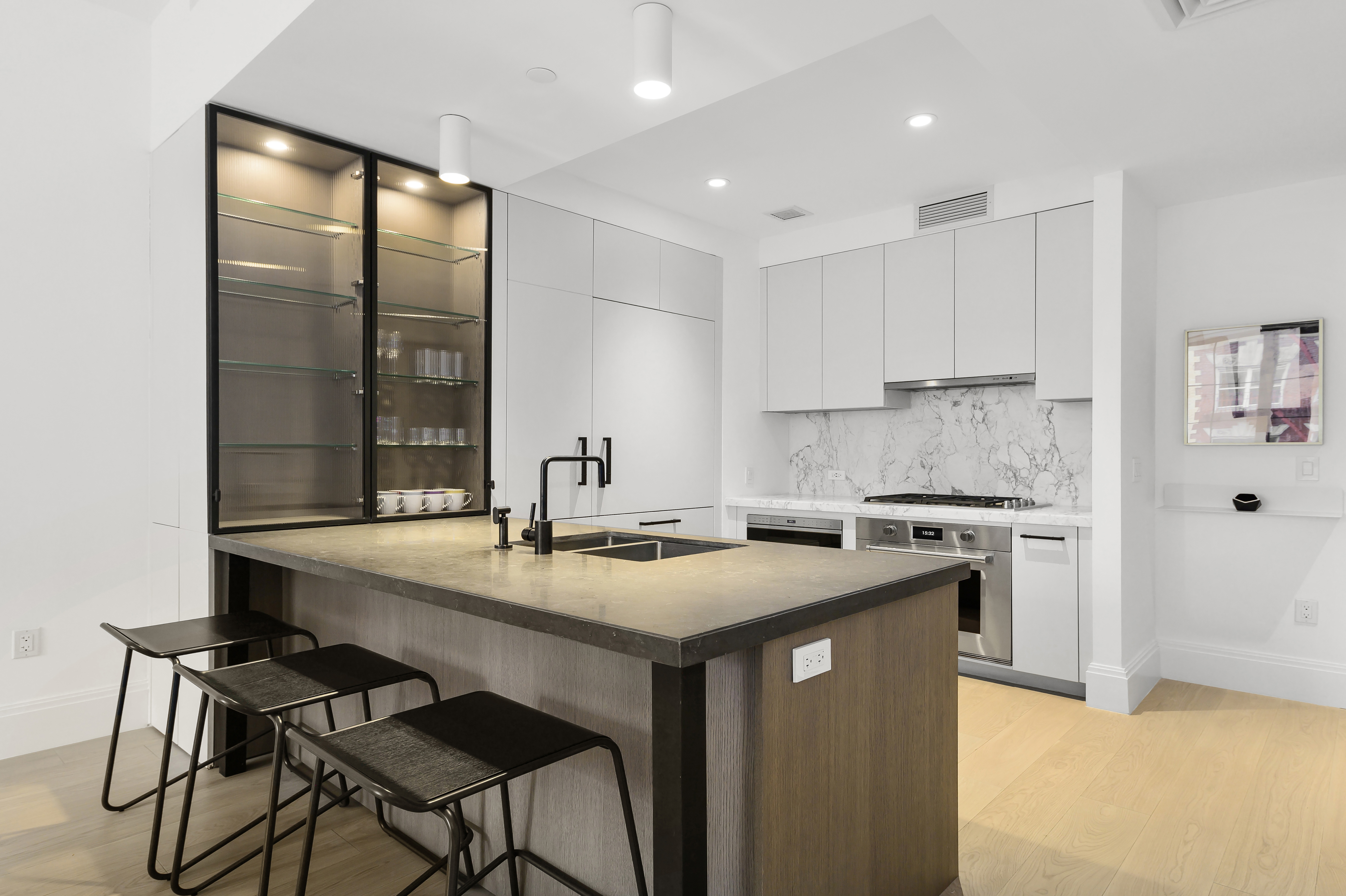 438 East 12th Street, Unit 5B Manhattan, NY 10009 - Photo 2 of 9 a kitchen with a stove a sink and a refrigerator