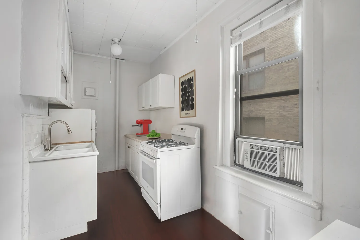 a utility room with sink dryer and washer