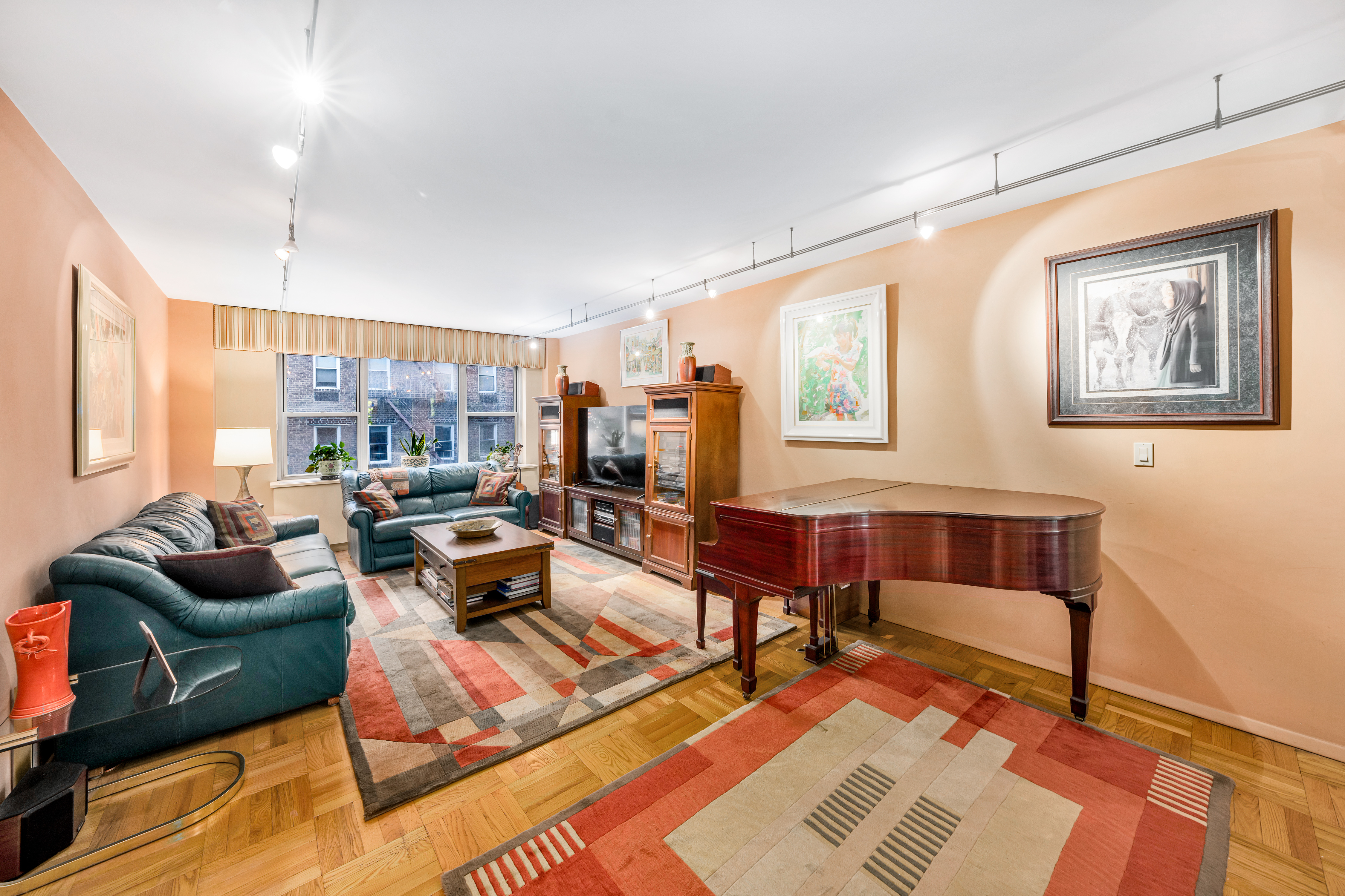 80 East End Avenue, Unit 3HJ Manhattan, NY 10028 - Photo 14 of 17 a living room with furniture and a window