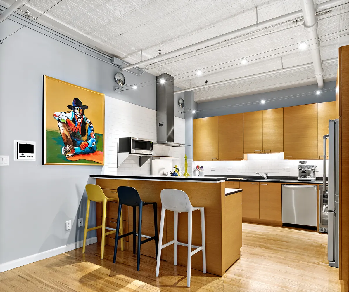 a kitchen with a table and chairs in it