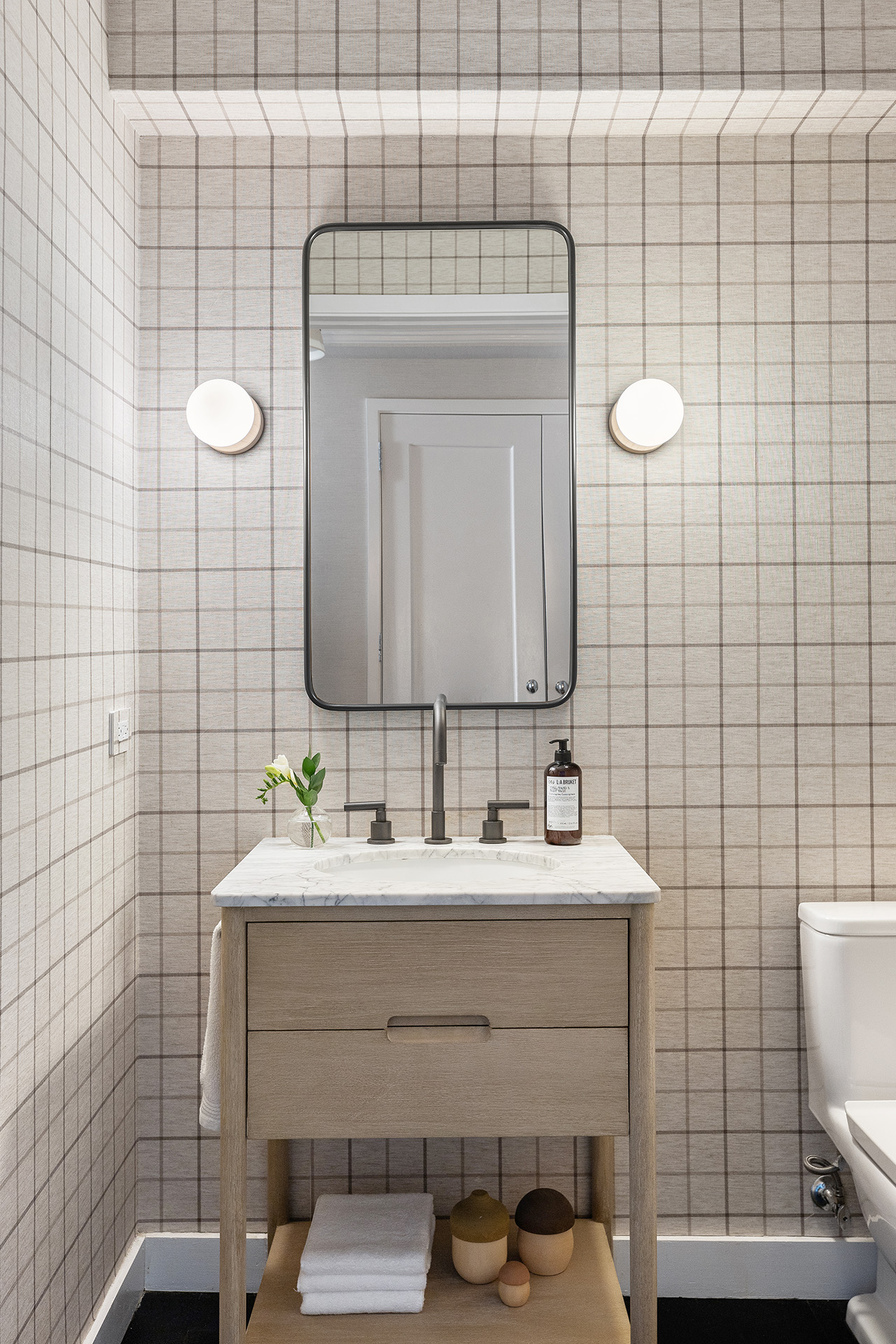 101 West 12th Street, Unit 8RS Manhattan, NY 10011 - Photo 17 of 19 a bathroom with a sink toilet and mirror