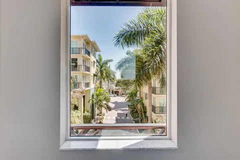 a view of a building with glass windows and door