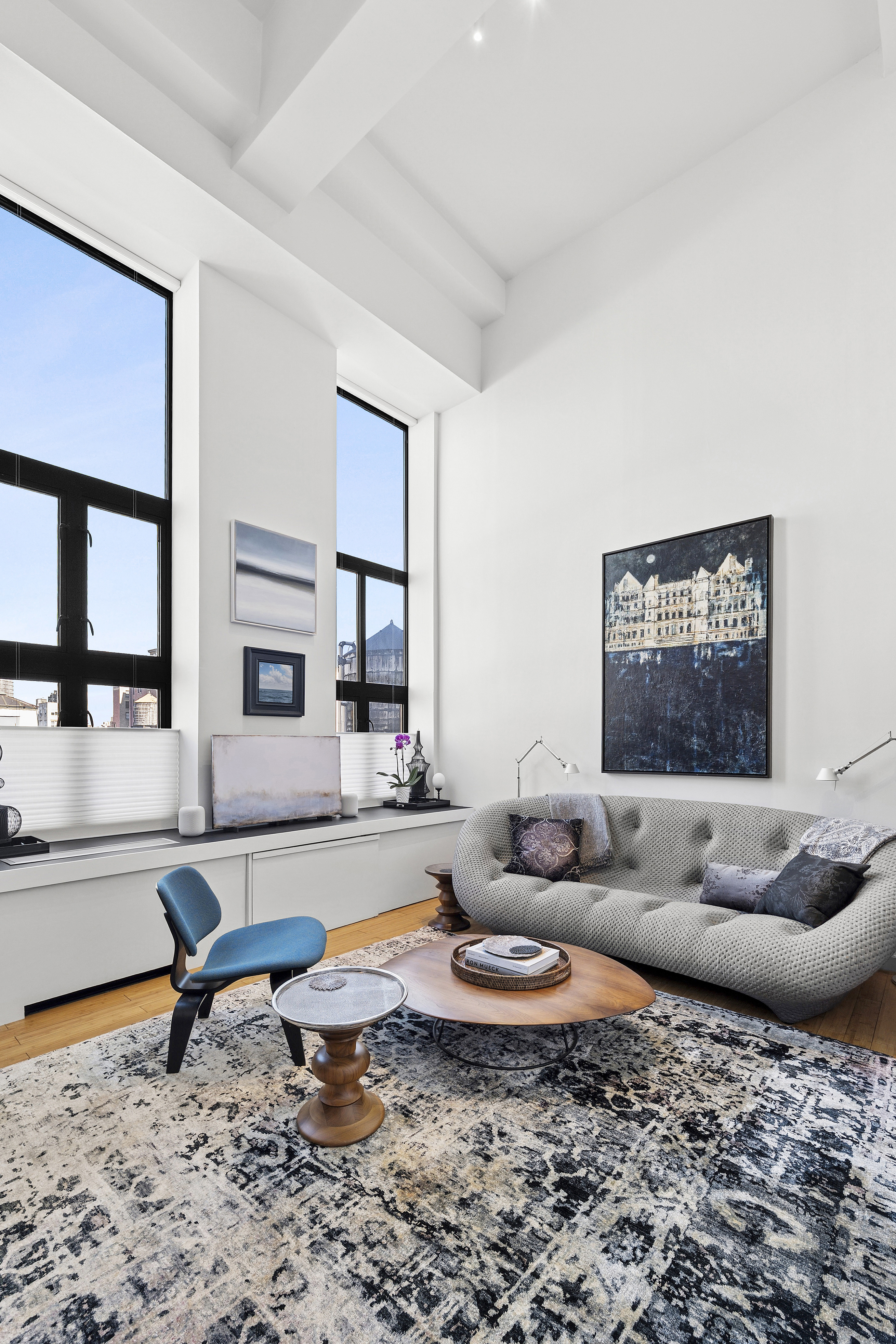 135 West 70th Street, Unit 8A Manhattan, NY 10023 - Photo 2 of 14 a living room with furniture and a rug