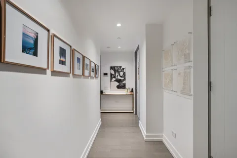 a view of a hallway with white walls
