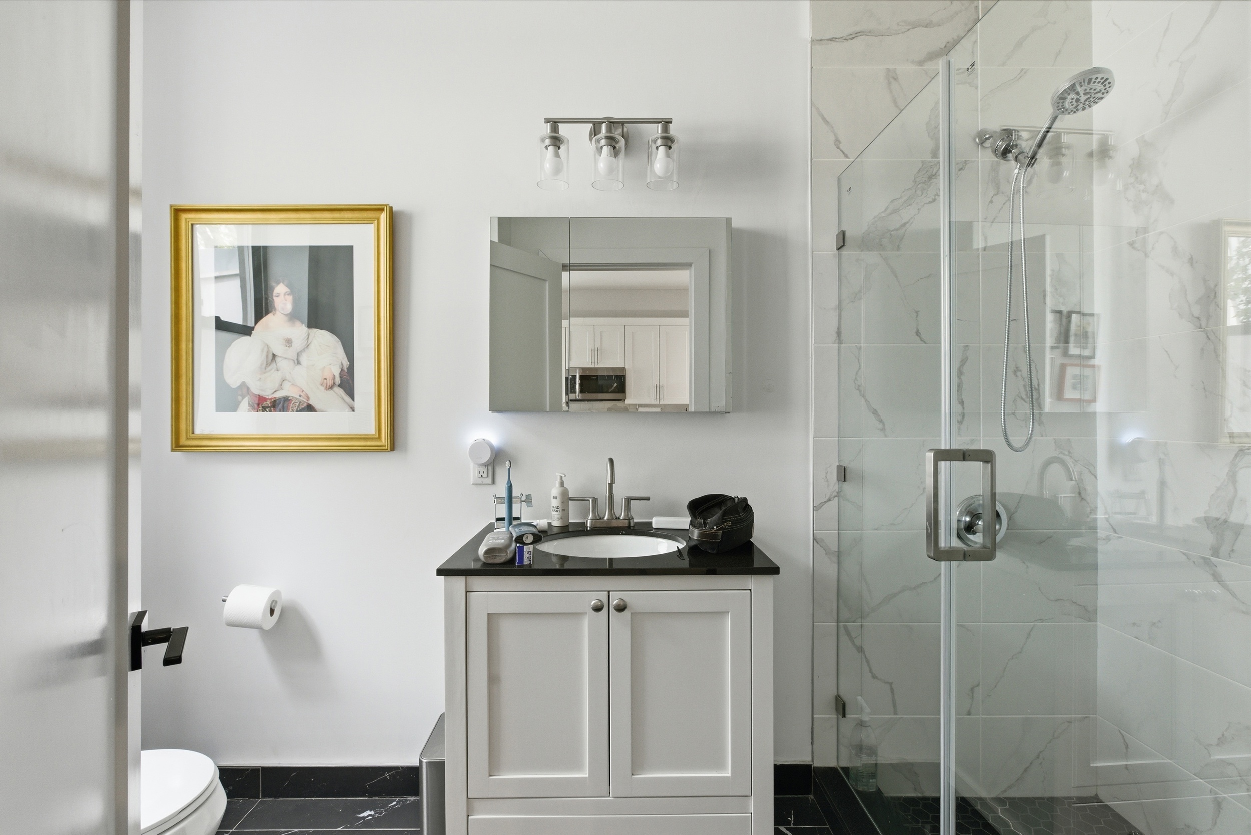 29 Greenpoint Avenue Brooklyn, NY 11222 - Photo 13 of 18 a bathroom with a sink and mirror
