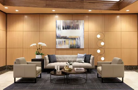 a living room with furniture and a large window