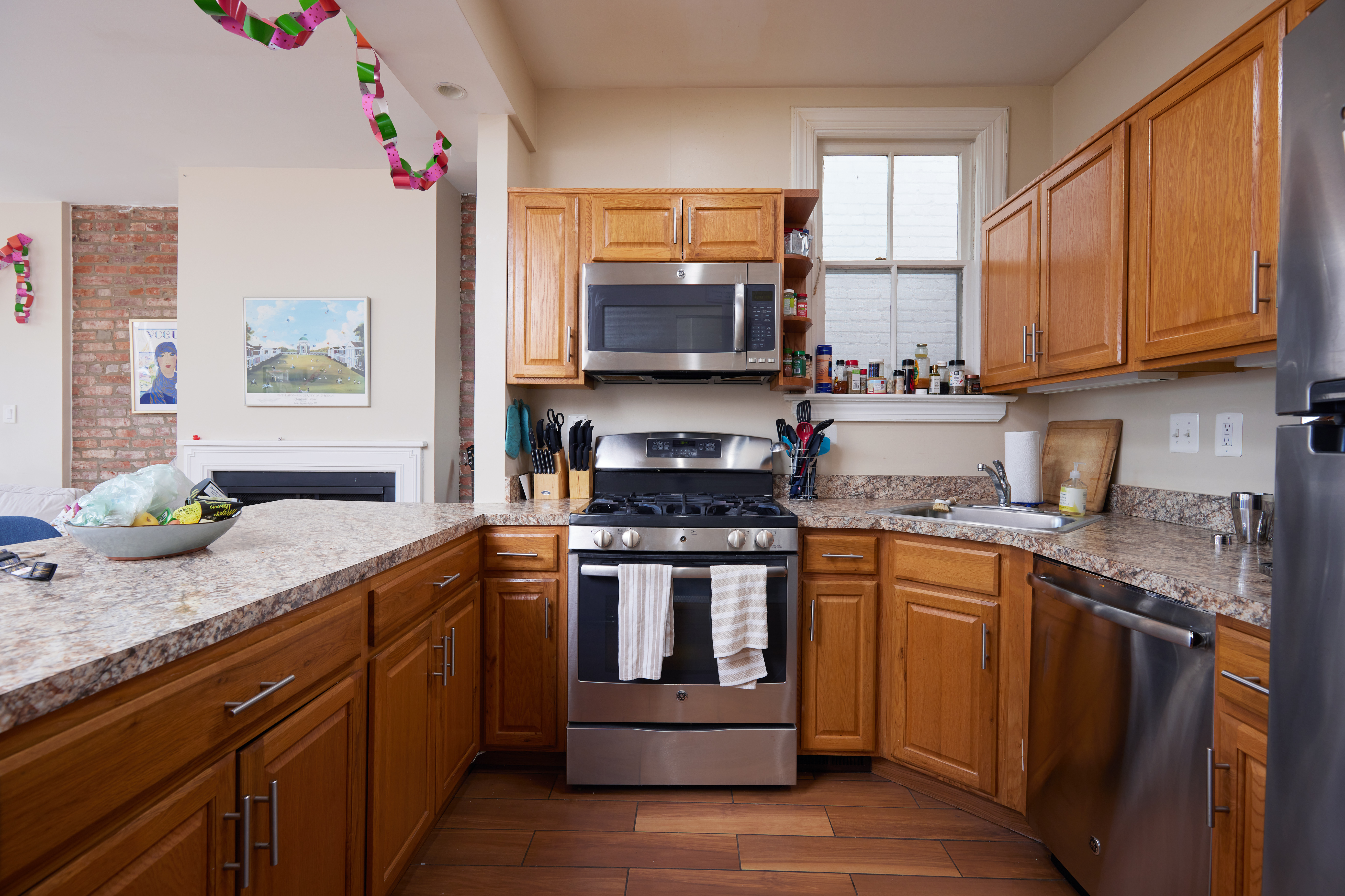 3420 R Street Northwest Washington, DC 20007 - Photo 7 of 53 a kitchen with stainless steel appliances granite countertop a stove a sink and a microwave