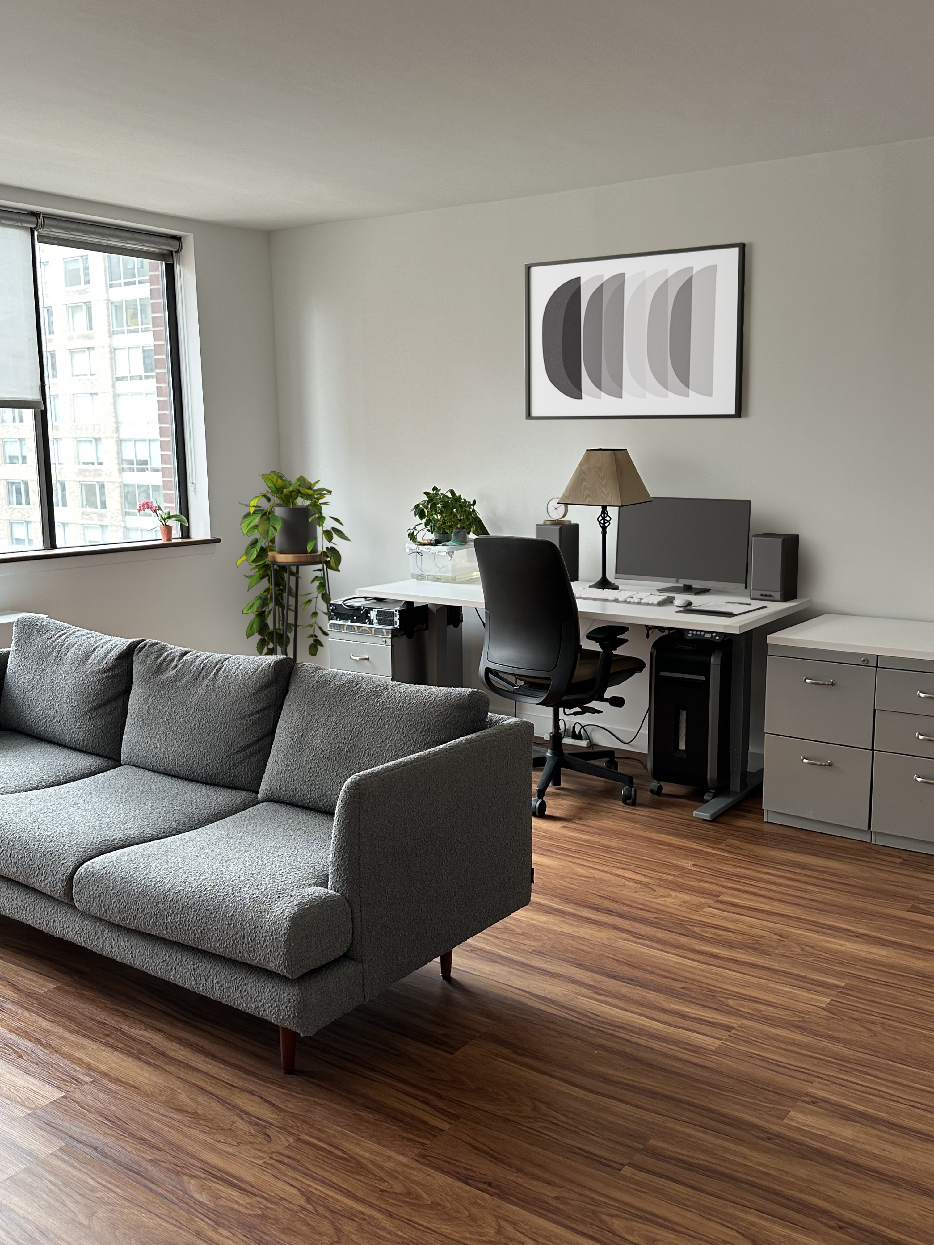 45 West 67th Street, Unit 21C Manhattan, NY 10023 - Photo 4 of 10 a living room with furniture a piano and a window