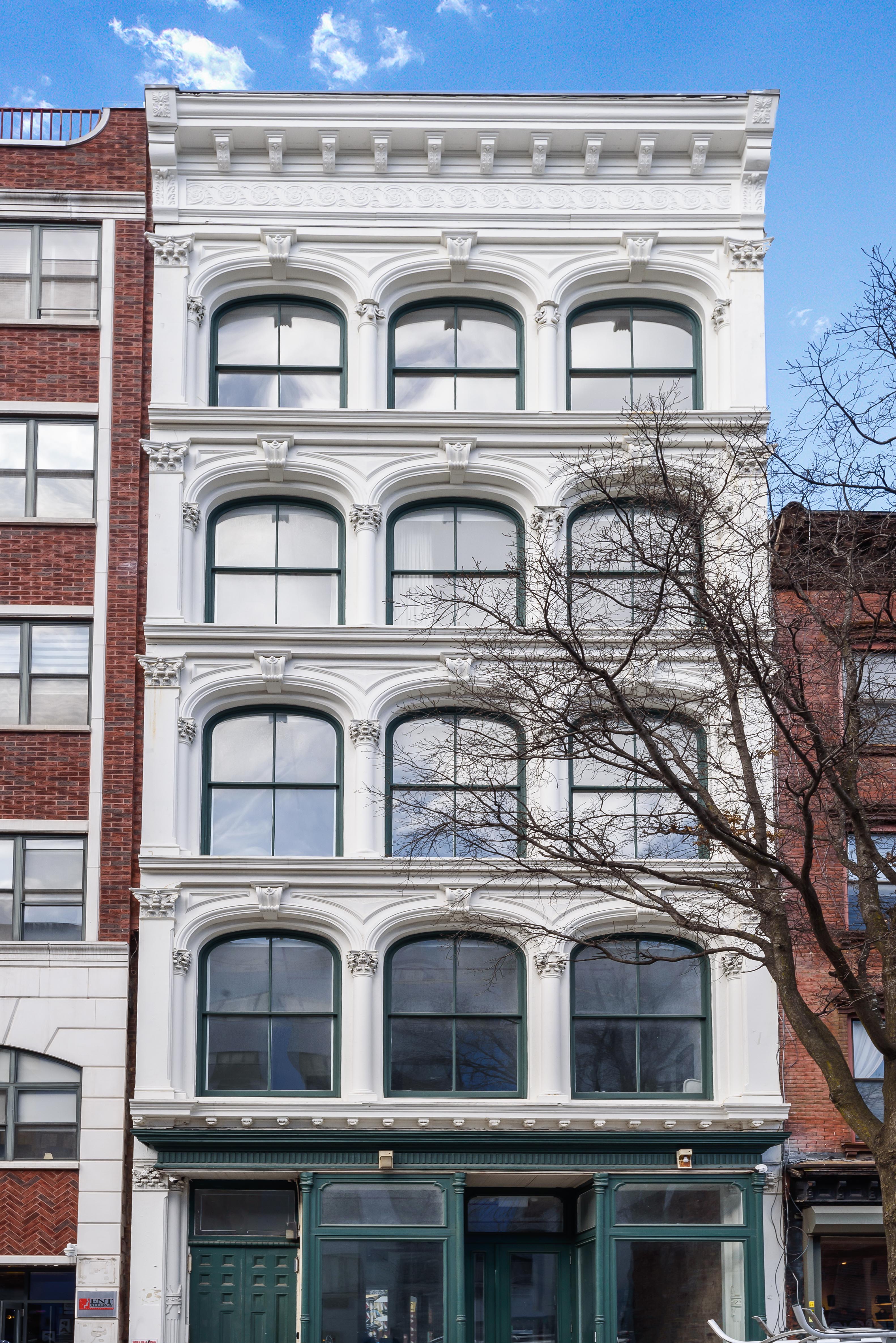 103 Broadway, Unit 4 Brooklyn, NY 11249 - Photo 7 of 7 a building with a clock on the top