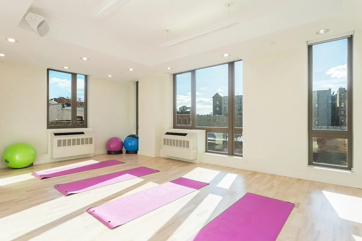 626 Flatbush Avenue, Unit 9H Brooklyn, NY 11225 - Photo 8 of 18 a bedroom with furniture and a large window