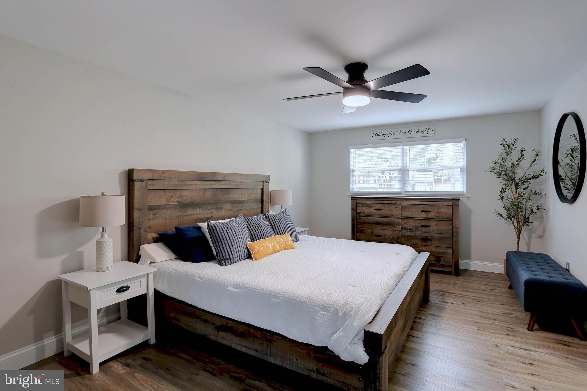 6257 Fairbourne Court Hanover, MD 21076 - Photo 23 of 47 a bedroom with a bed and a ceiling fan