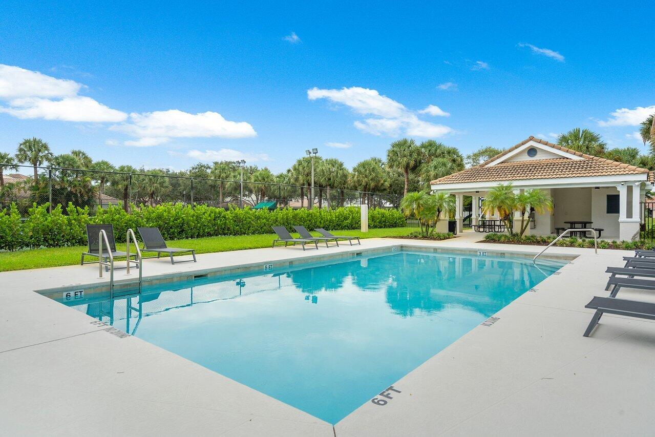 1182 Canoe Point Delray Beach, FL 33444 - Photo 45 of 46 a view of a swimming pool with a patio