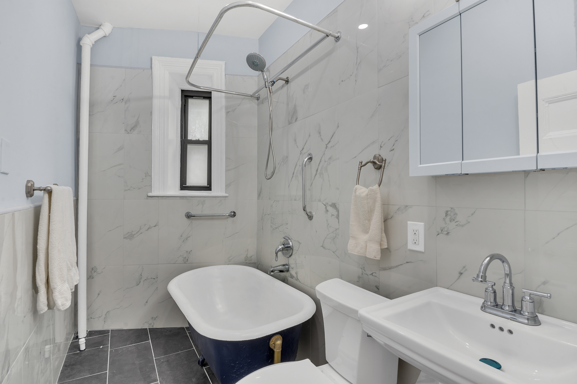 100 Hamilton Place, Unit 2F Manhattan, NY 10031 - Photo 8 of 21 a bathroom with a sink toilet and a mirror