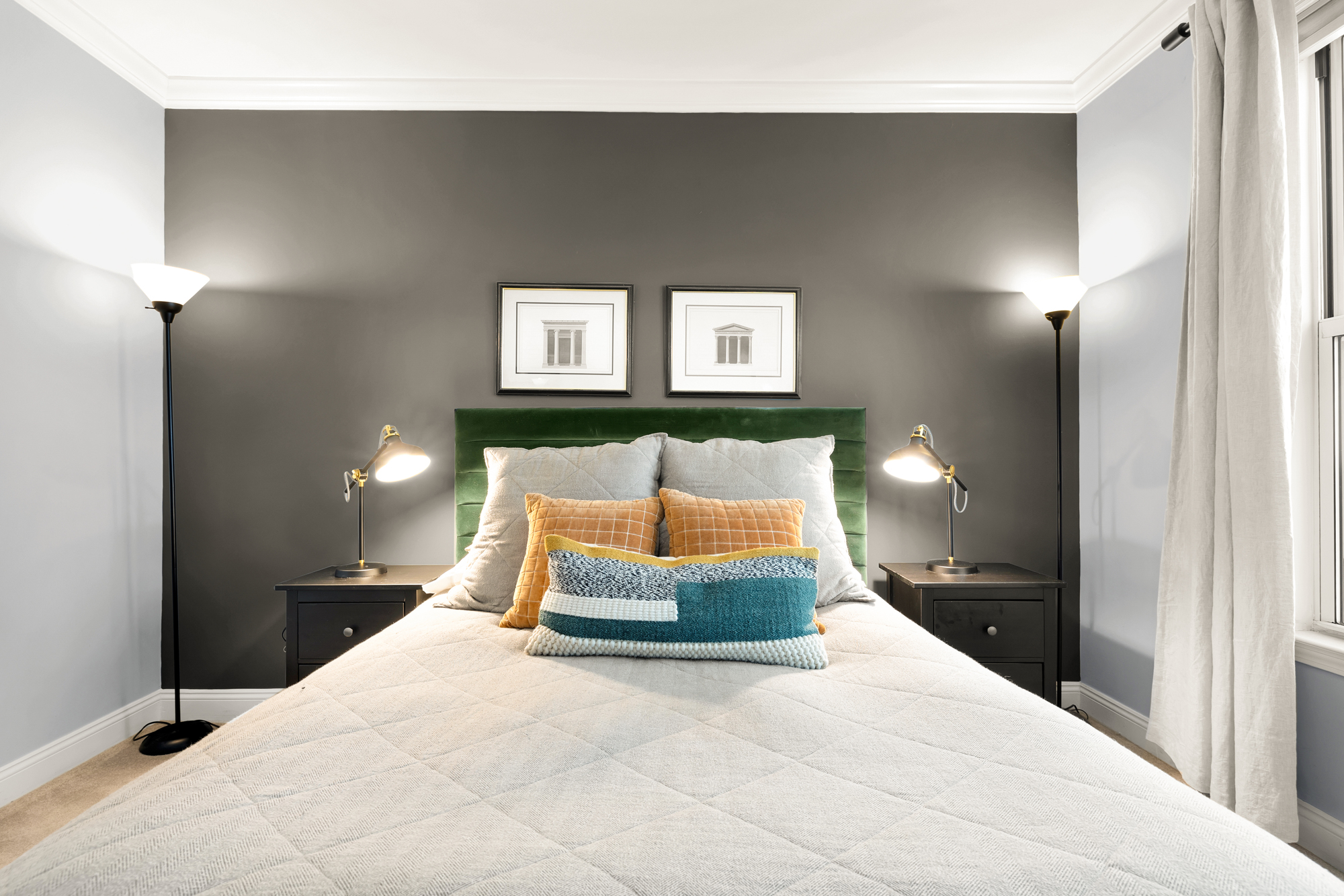 1391 Pennsylvania Ave. Southeast, Unit 324 Washington, DC 20003 - Photo 19 of 33 a bedroom with a bed and lamp