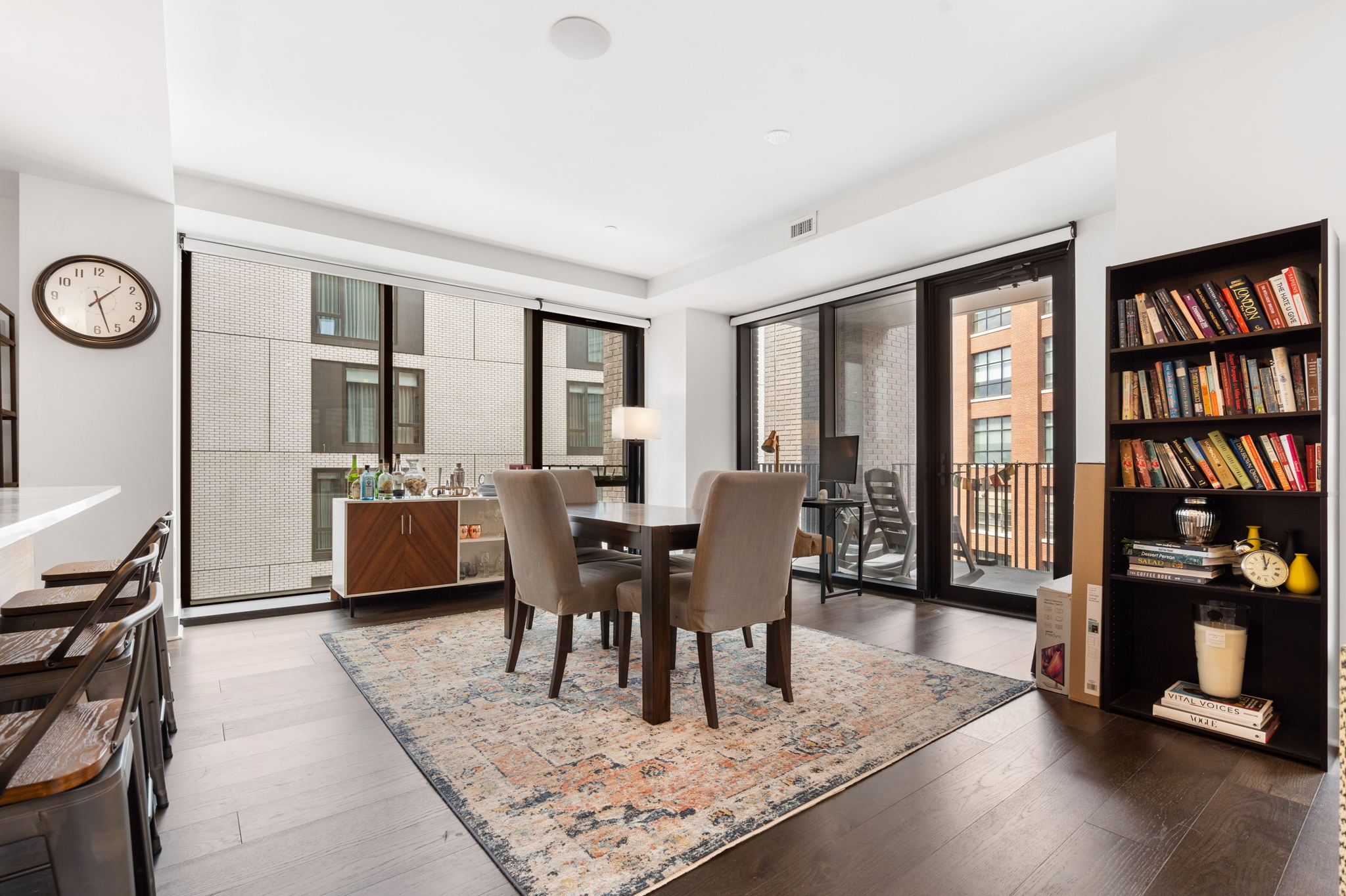 14 West Broadway, Unit 601 South Boston, MA 02127 - Photo 4 of 20 a view of a dining room with furniture window and wooden floor