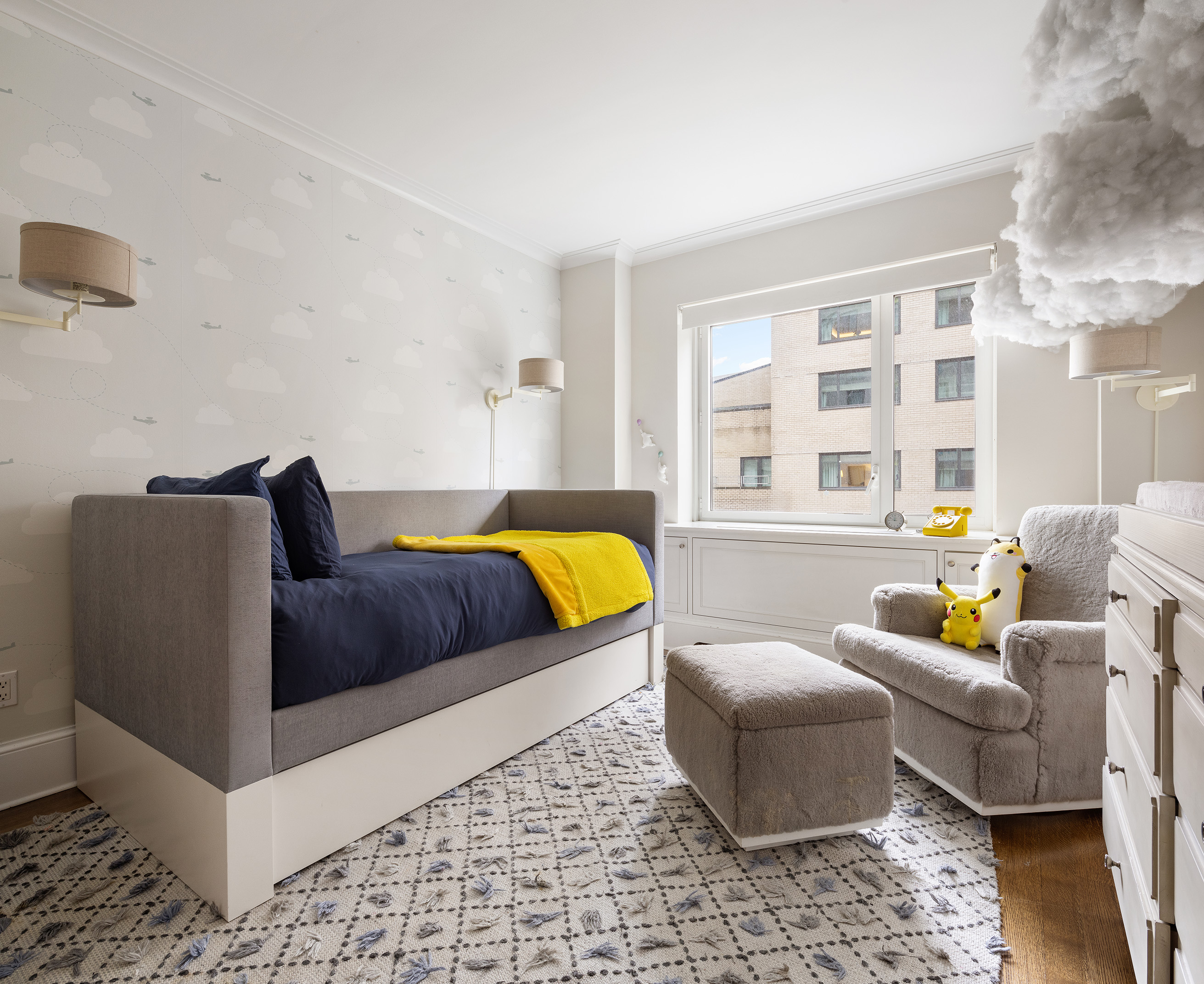 530 Park Avenue, Unit 14D Manhattan, NY 10065 - Photo 9 of 12 a bedroom with furniture and a large window