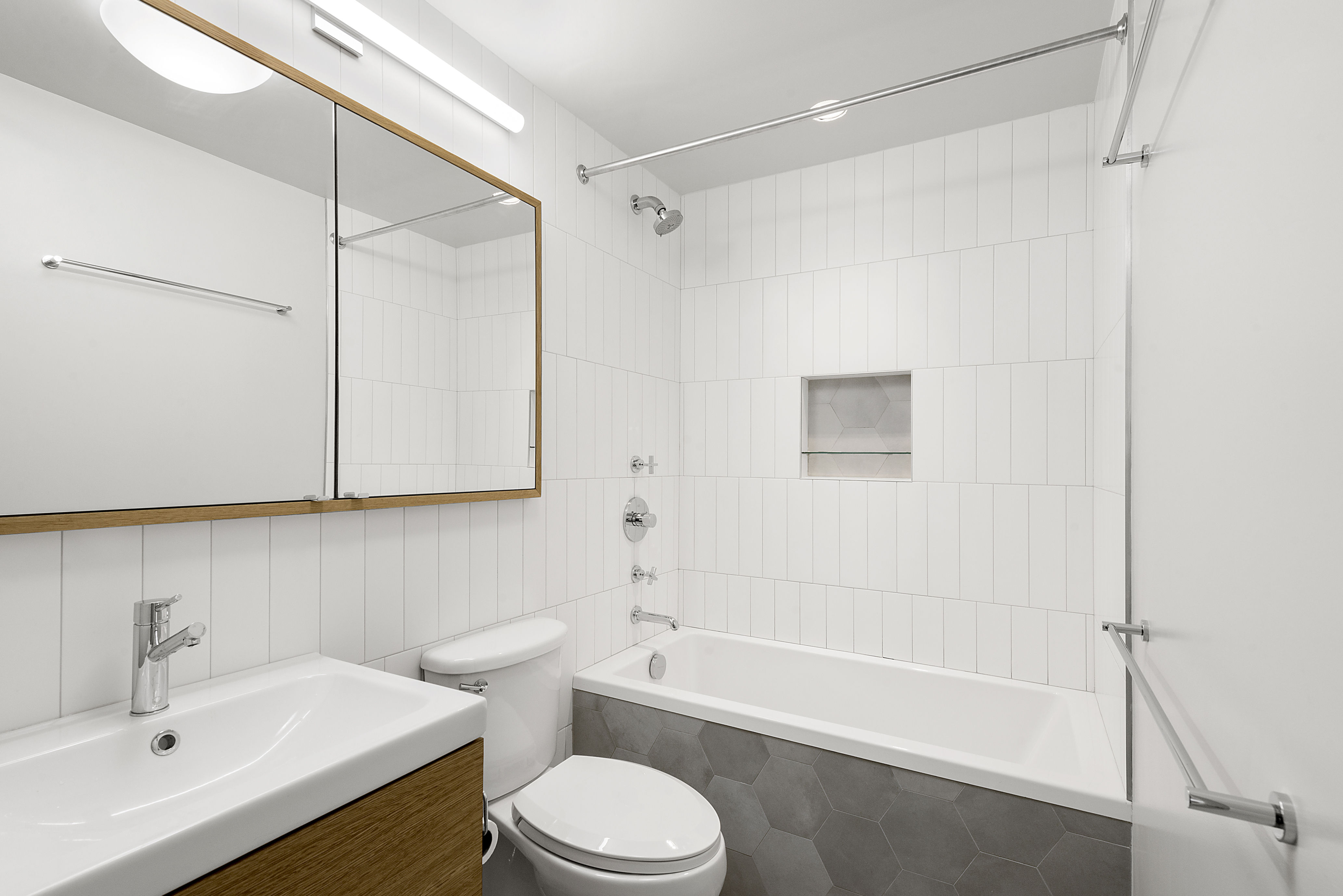 250 West 88th Street, Unit 703 Manhattan, NY 10024 - Photo 4 of 6 a bathroom with a sink a toilet and shower