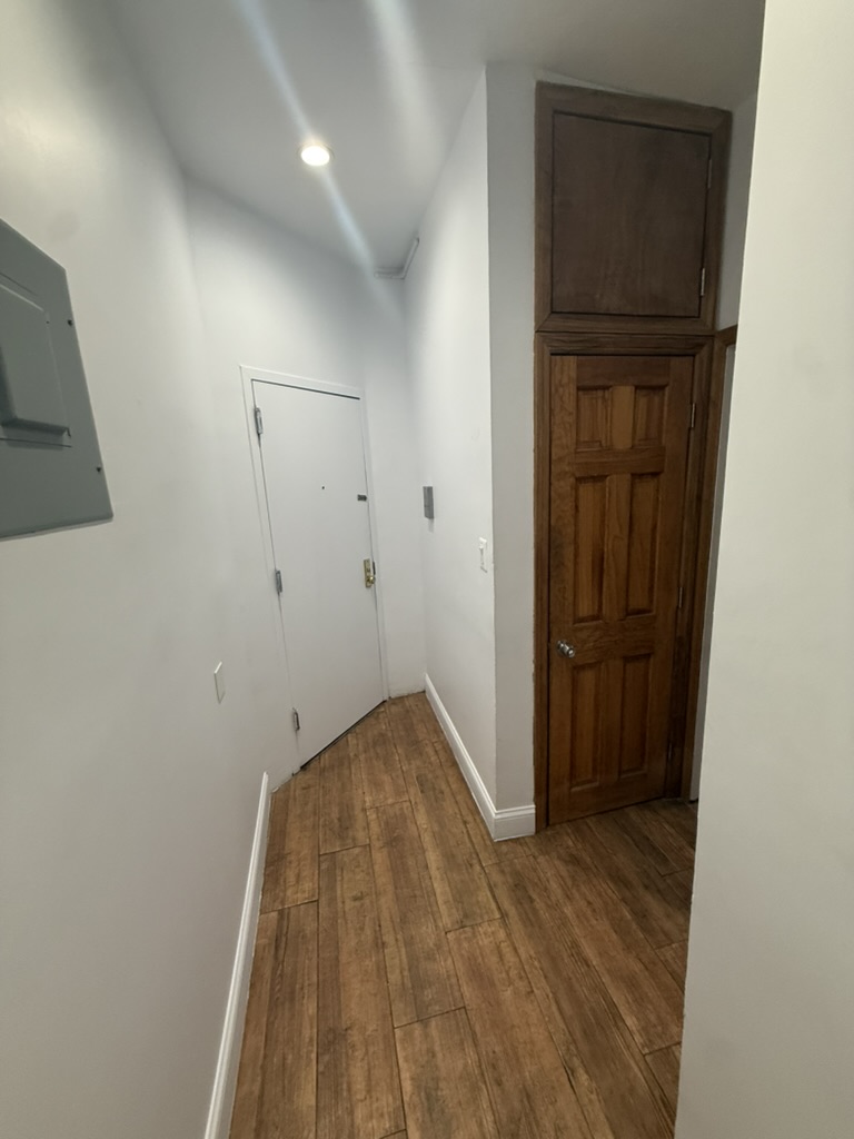 613 Marcy Avenue, Unit 1B Brooklyn, NY 11206 - Photo 7 of 8 a view of hallway with wooden floor