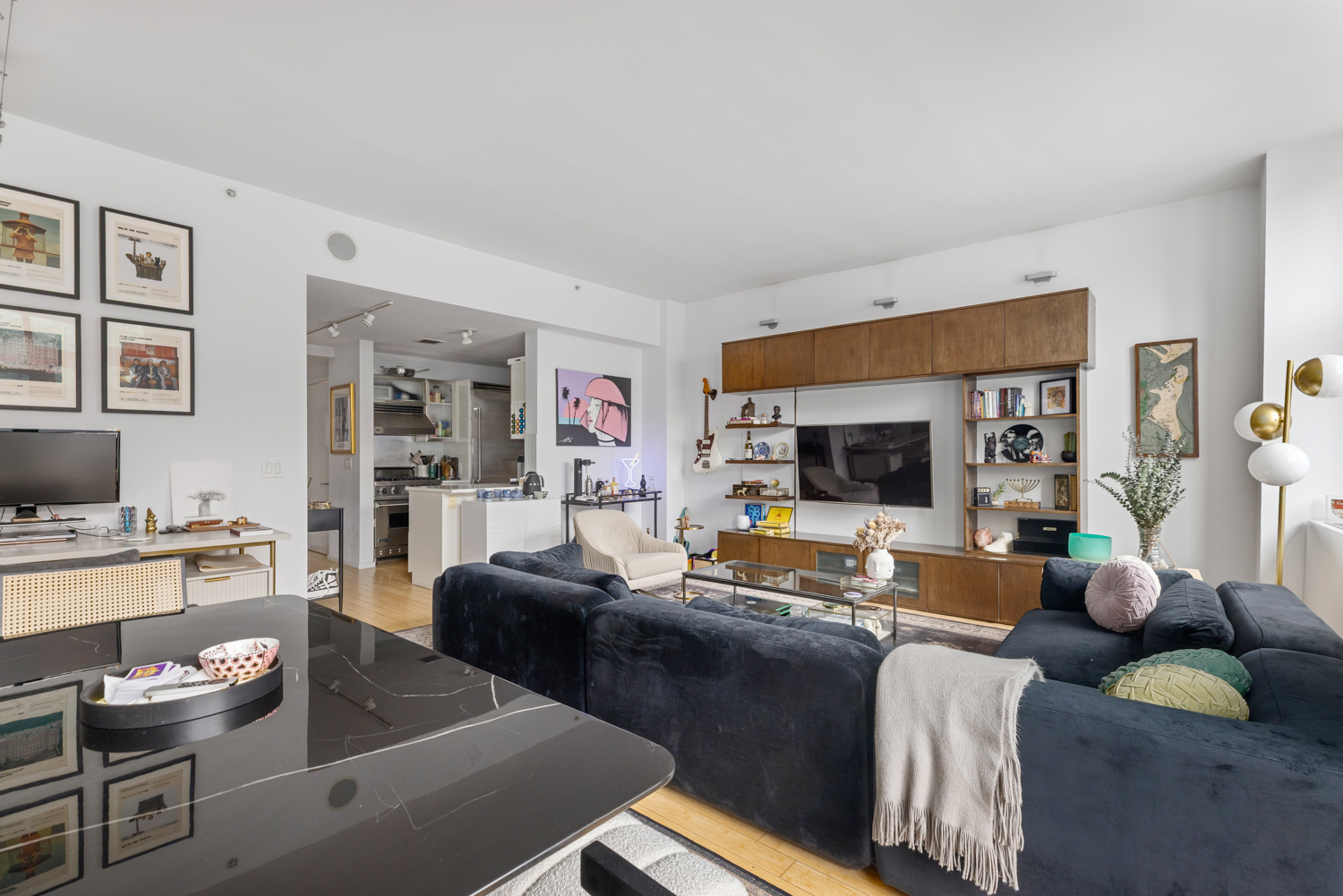 105 Norfolk Street, Unit 2A Manhattan, NY 10002 - Photo 4 of 16 a living room with furniture and a flat screen tv