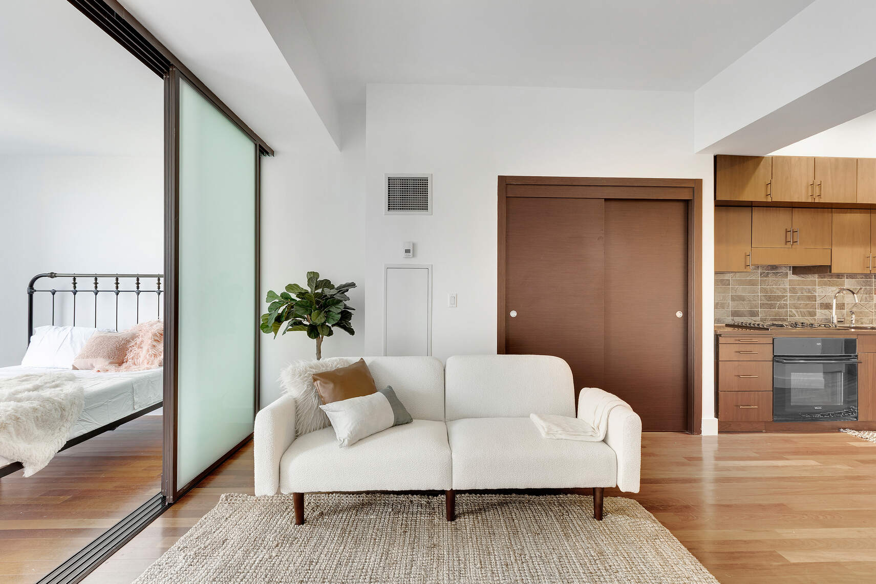 150 Myrtle Avenue, Unit 602 Brooklyn, NY 11201 - Photo 4 of 29 a living room with furniture and a rug