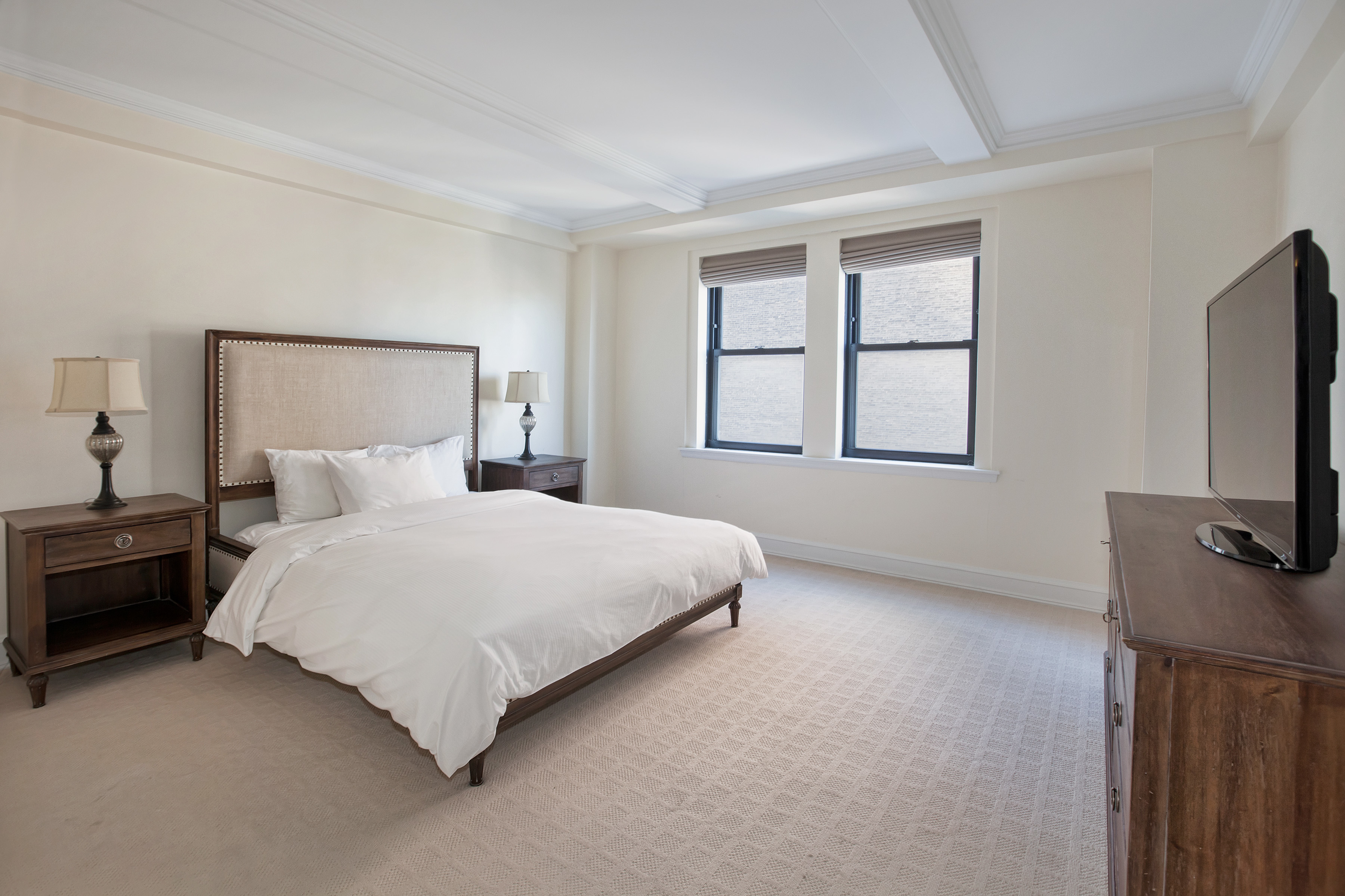 160 Central Park South, Unit 2307 Manhattan, NY 10019 - Photo 6 of 14 a bedroom with bed tv and window