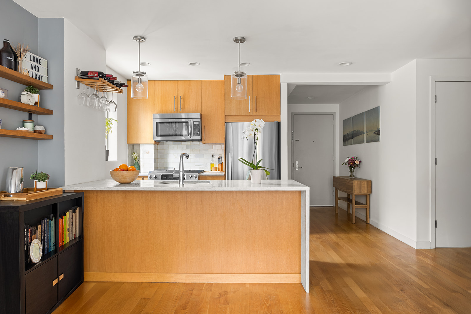 a kitchen with stainless steel appliances granite countertop a sink and a refrigerator