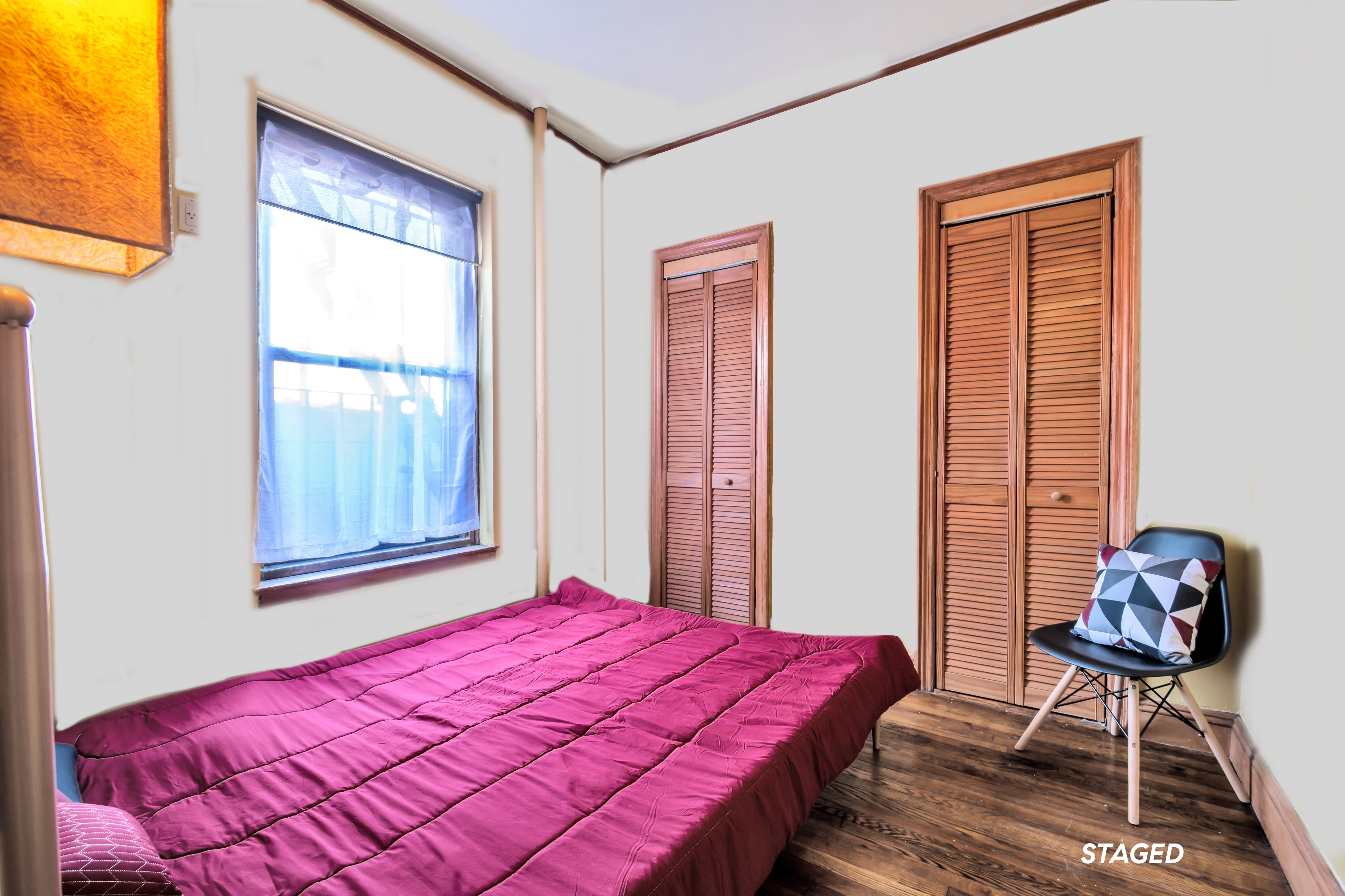 94 Hamilton Place, Unit 5E Manhattan, NY 10031 - Photo 3 of 13 a bedroom with a bed and a window