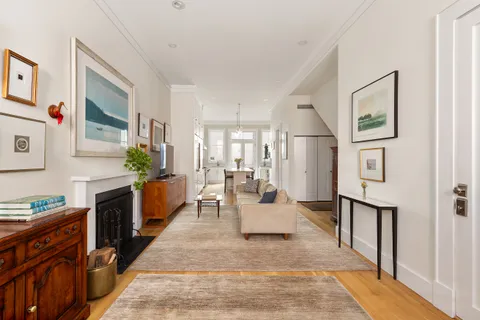 a living room with furniture windows and a fireplace