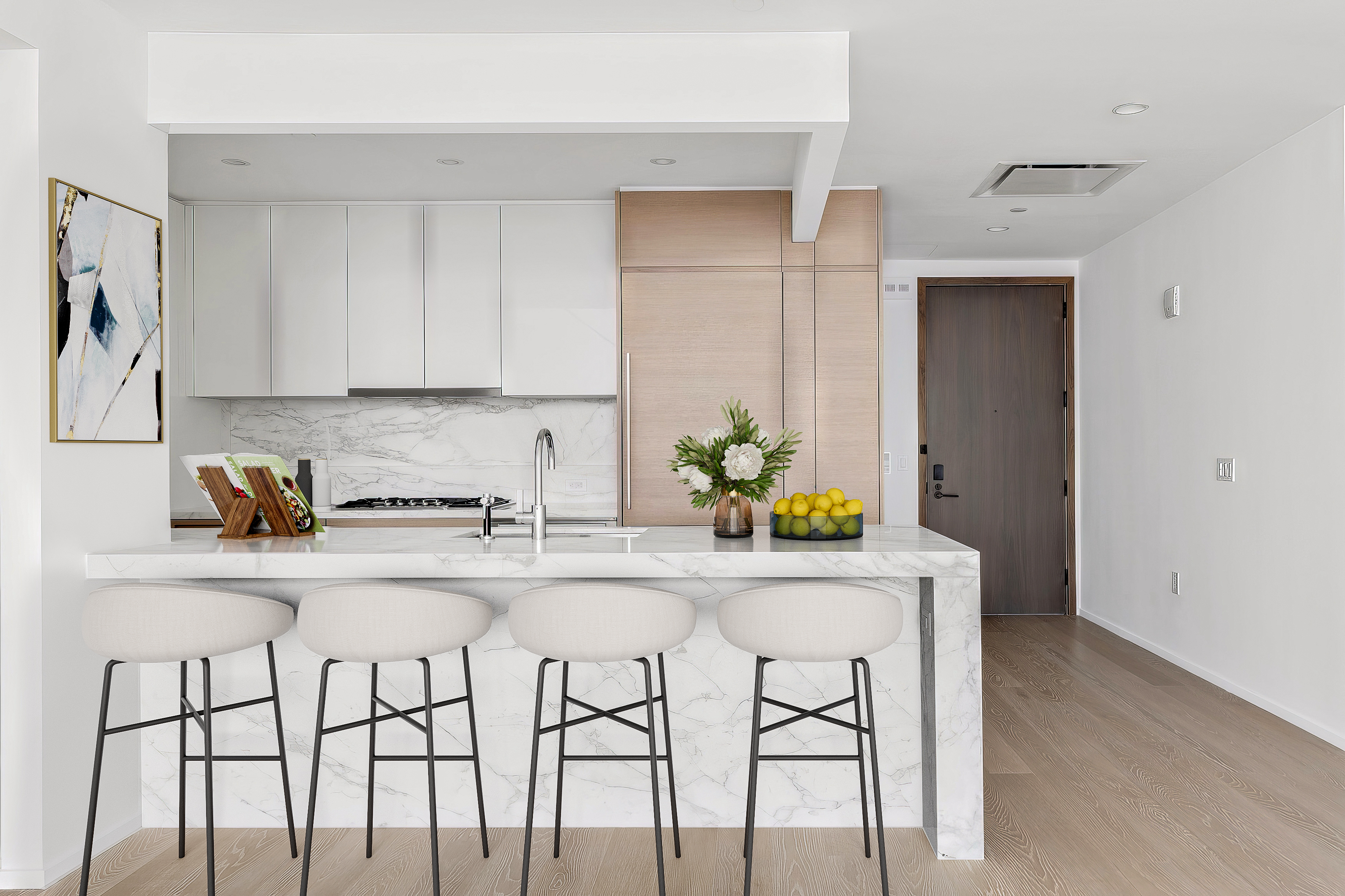30 Riverside Boulevard, Unit 32G Manhattan, NY 10069 - Photo 3 of 9 a white kitchen with a dining table and chairs