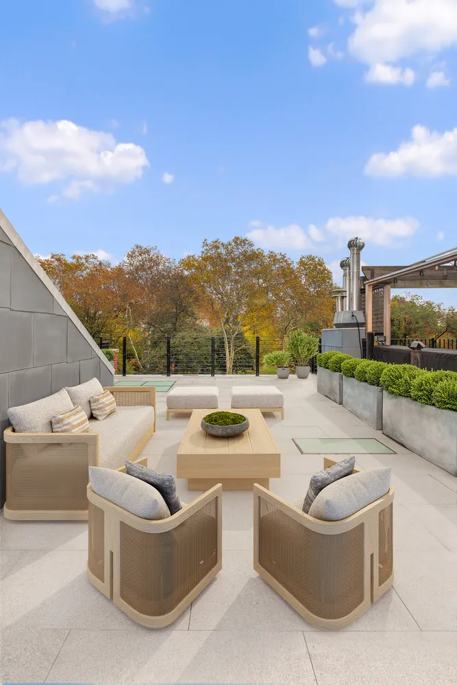 a view of a terrace with couches and a flat screen tv