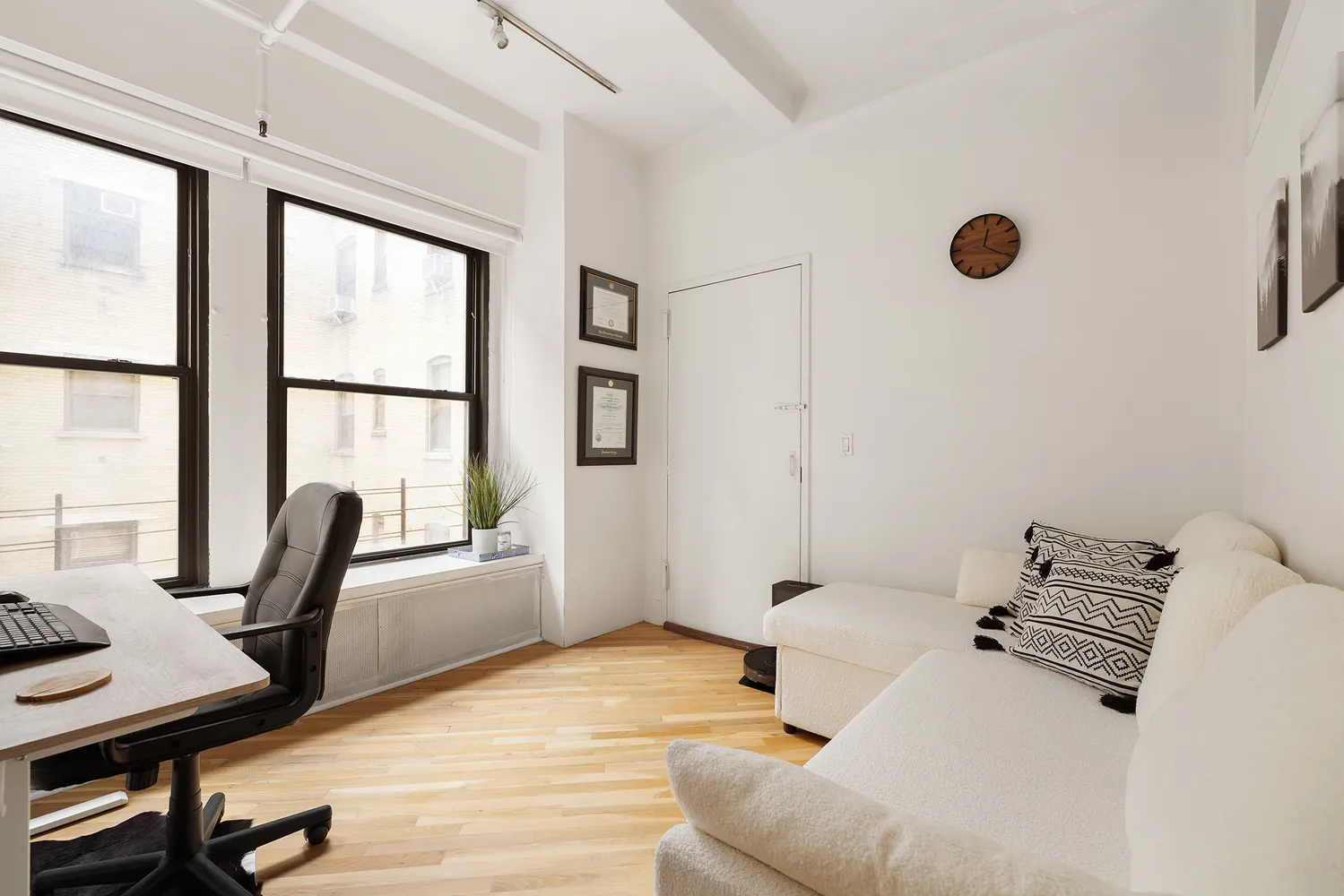 a bedroom with furniture and a window