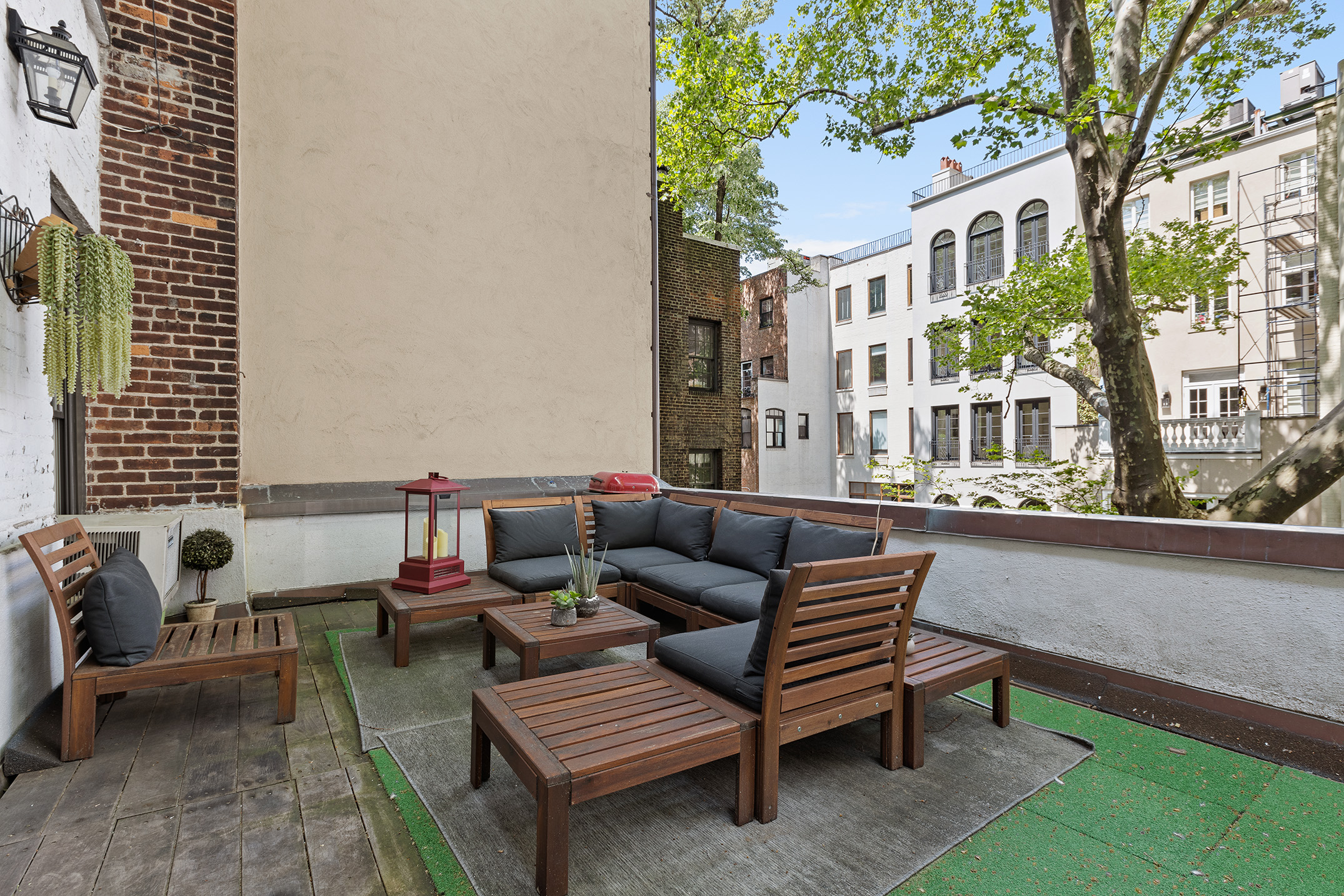 159 East 63rd Street, Unit 2/3 Manhattan, NY 10065 - Photo 4 of 13 a roof deck with a couch and chairs