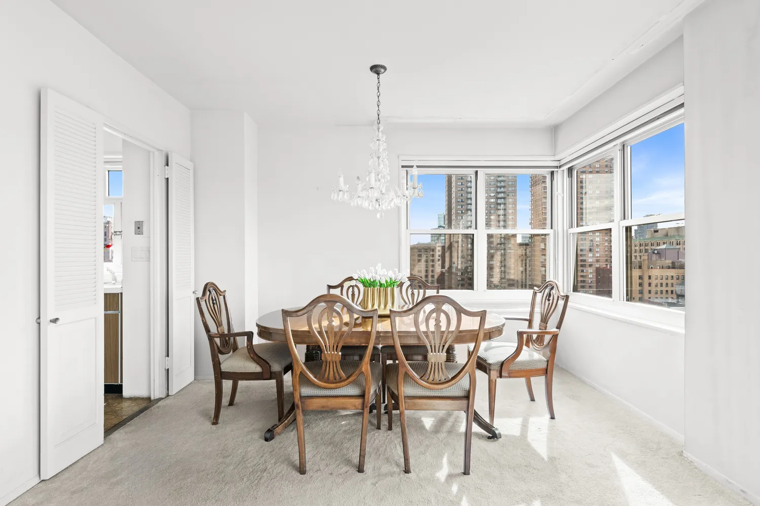 a view of a dining room with furniture window and outside view