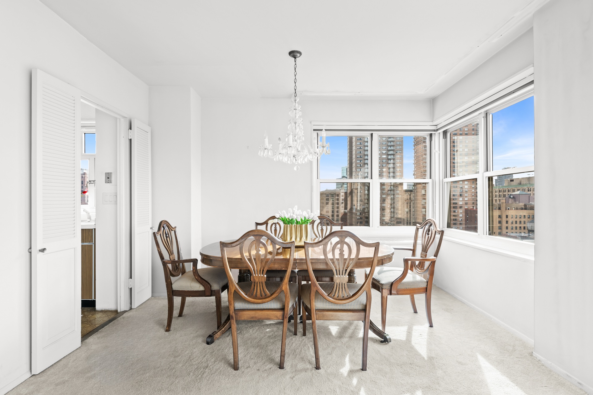 20 East 9th Street, Unit 18E Manhattan, NY 10003 - Photo 13 of 40 a view of a dining room with furniture window and outside view