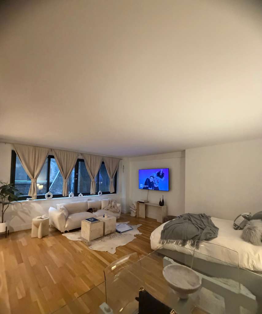 116 Central Park South, Unit 3G Manhattan, NY 10019 - Photo 7 of 8 a living room with furniture