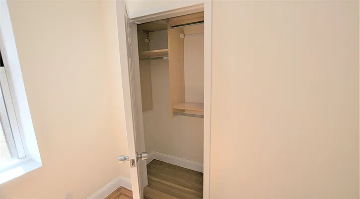 117 West 13th Street, Unit 25 Manhattan, NY 10011 - Photo 4 of 7 a bathroom with a door