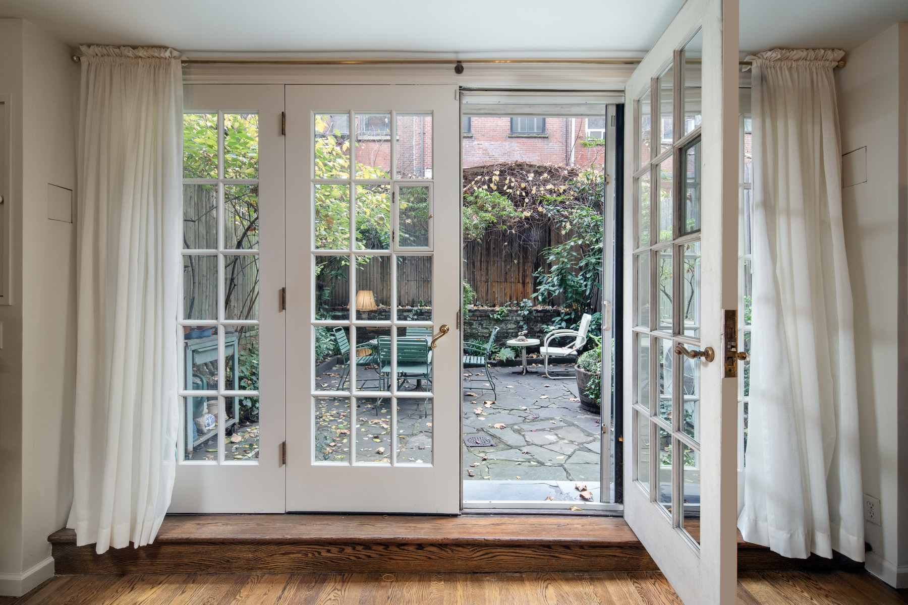 28 West 10th Street Manhattan, NY 10011 - Photo 8 of 12 a view of front door and porch with wooden floor