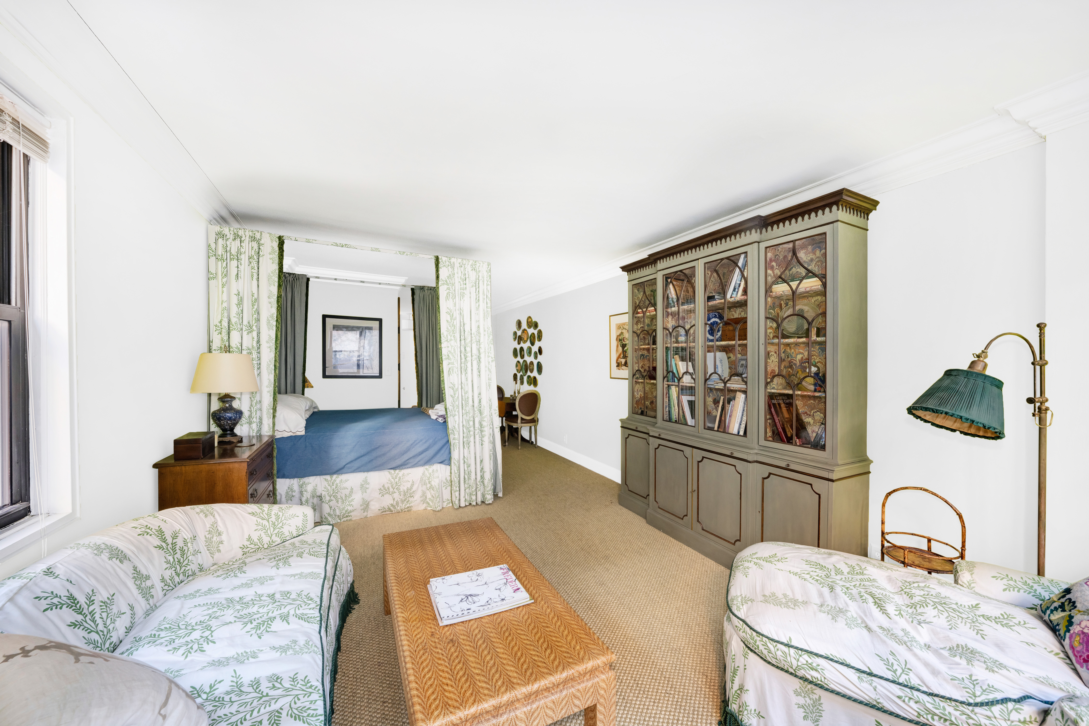 345 East 52nd Street, Unit 2C Manhattan, NY 10022 - Photo 1 of 6 a living room with furniture and a window