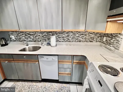 a bathroom with a sink a toilet and vanity