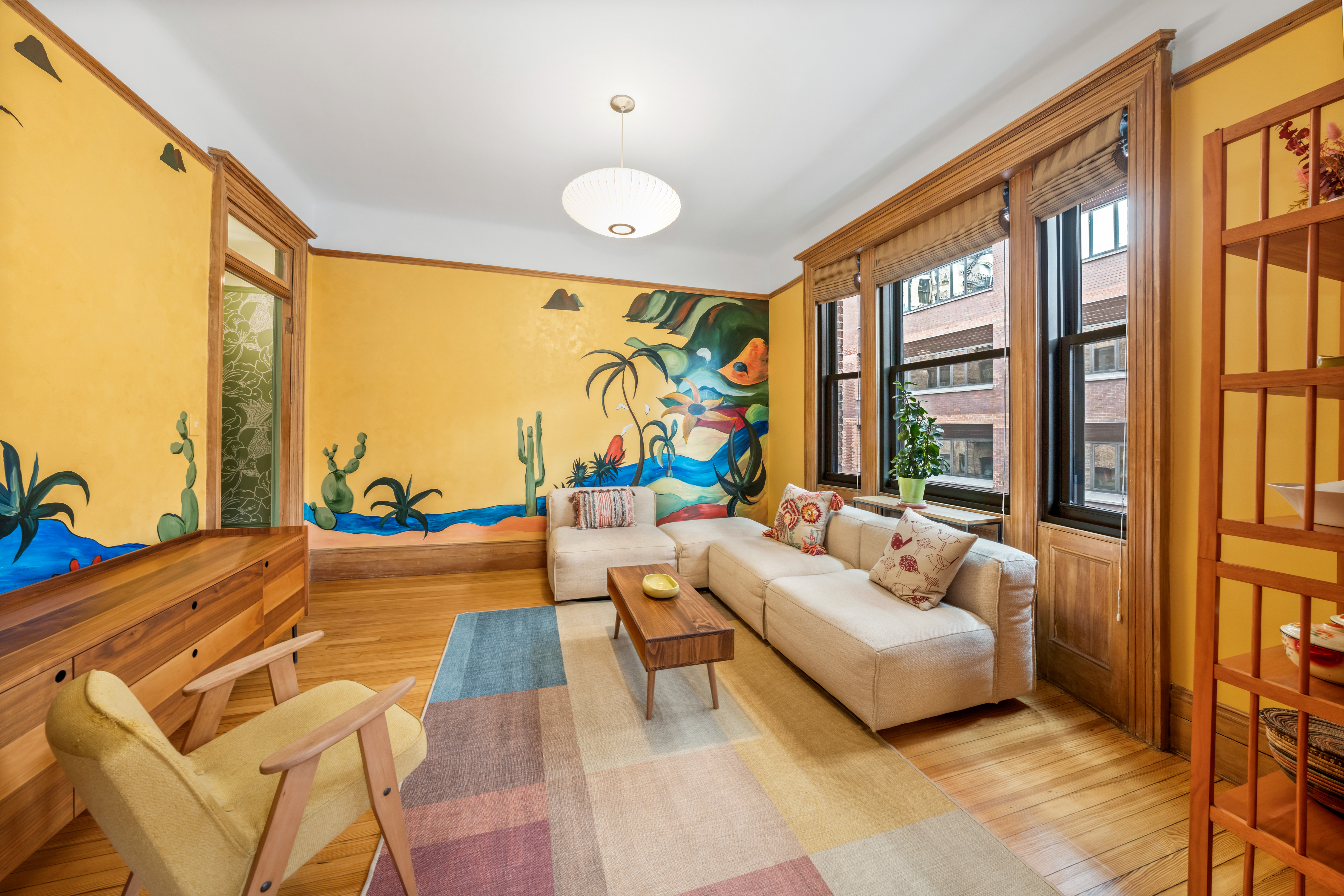 605 West 111th Street, Unit 43 Manhattan, NY 10025 - Photo 3 of 21 a living room with furniture and a large window