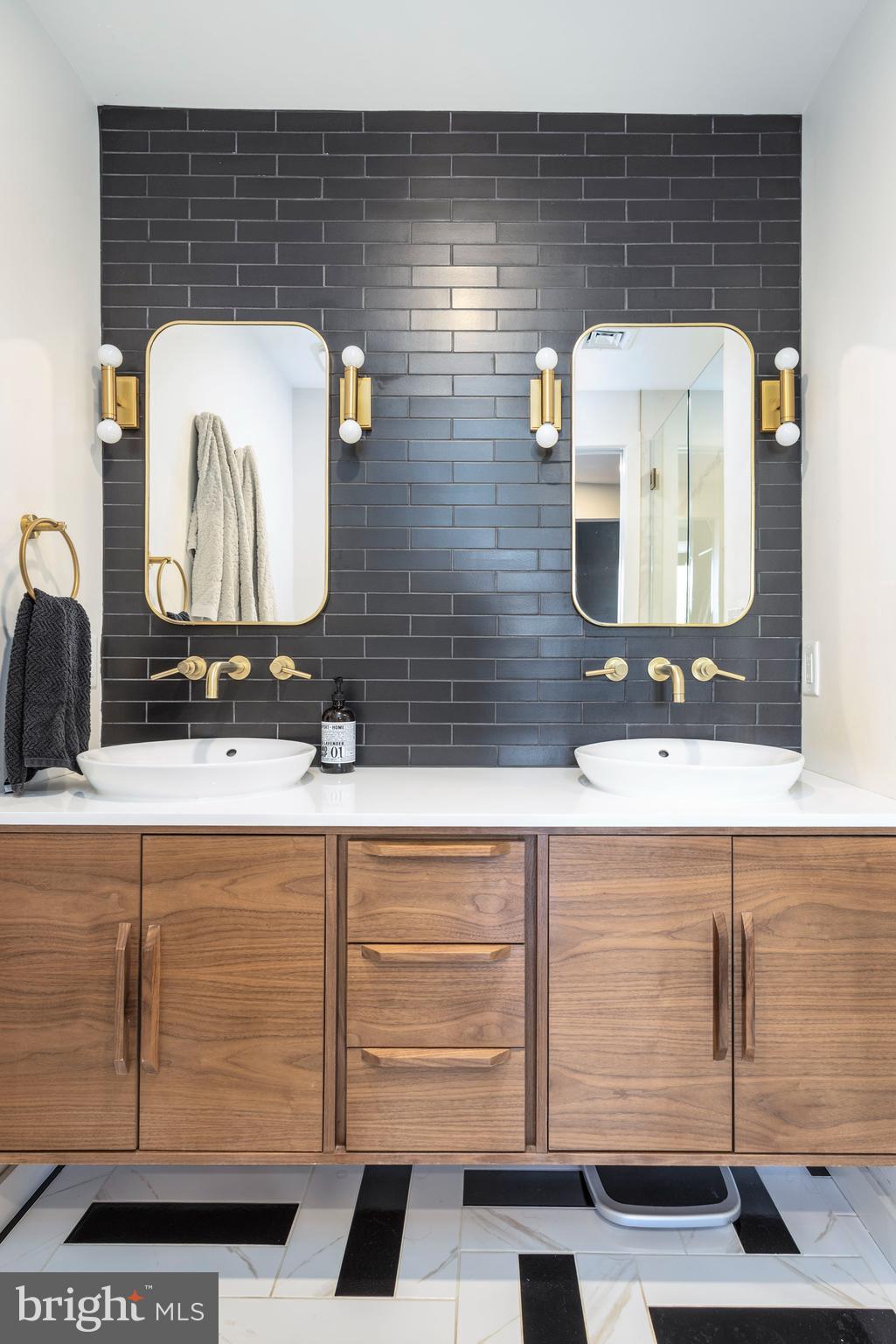 283 Locust Street Philadelphia, PA 19106 - Photo 17 of 33 a bathroom with a sink and a mirror