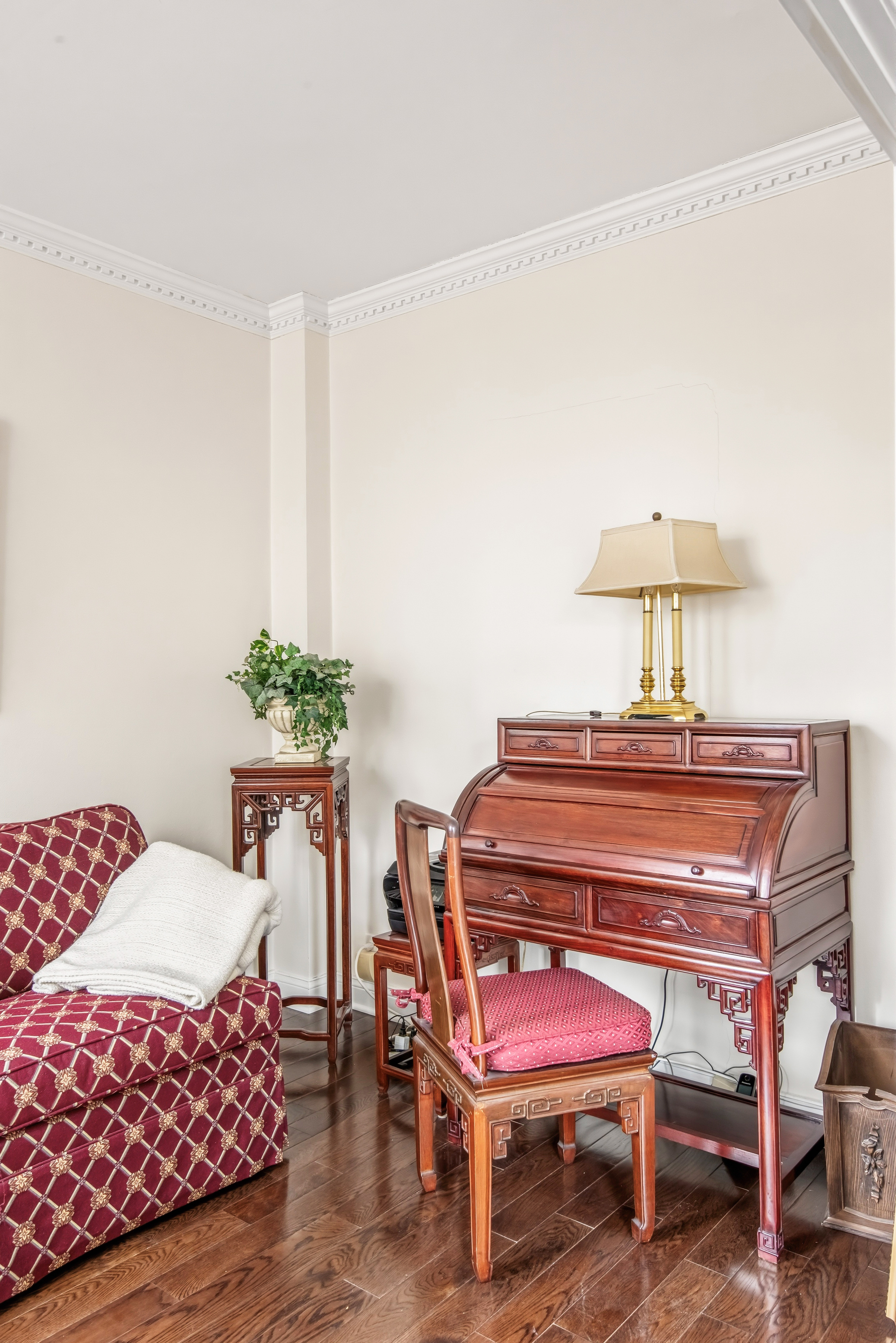 175 East 62nd Street, Unit 14B Manhattan, NY 10065 - Photo 6 of 12 a living room with furniture and a chair