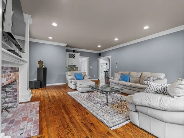 a living room with furniture and a rug