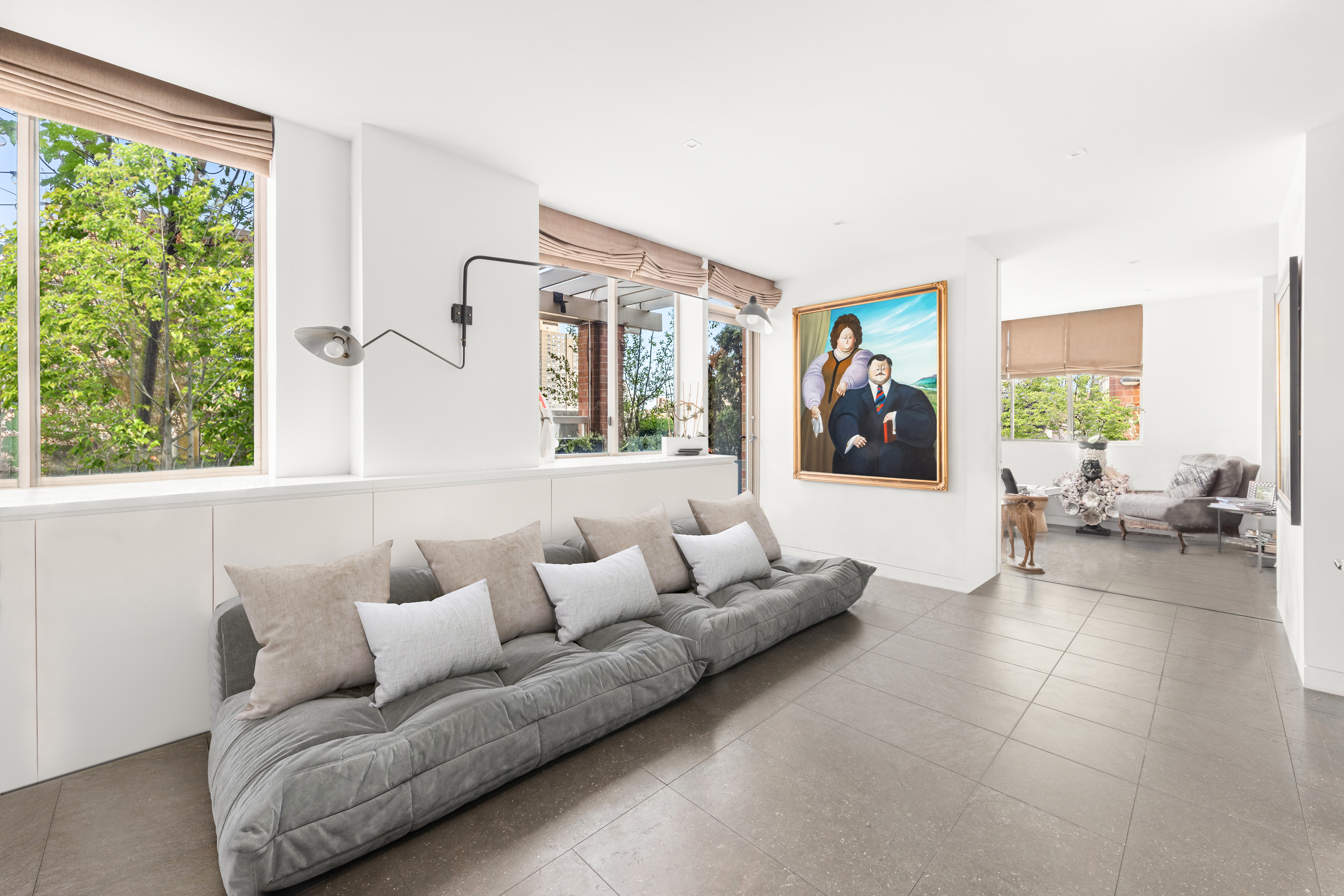 350 East 82nd Street, Unit 14AB Manhattan, NY 10028 - Photo 12 of 21 a living room with furniture and a large window