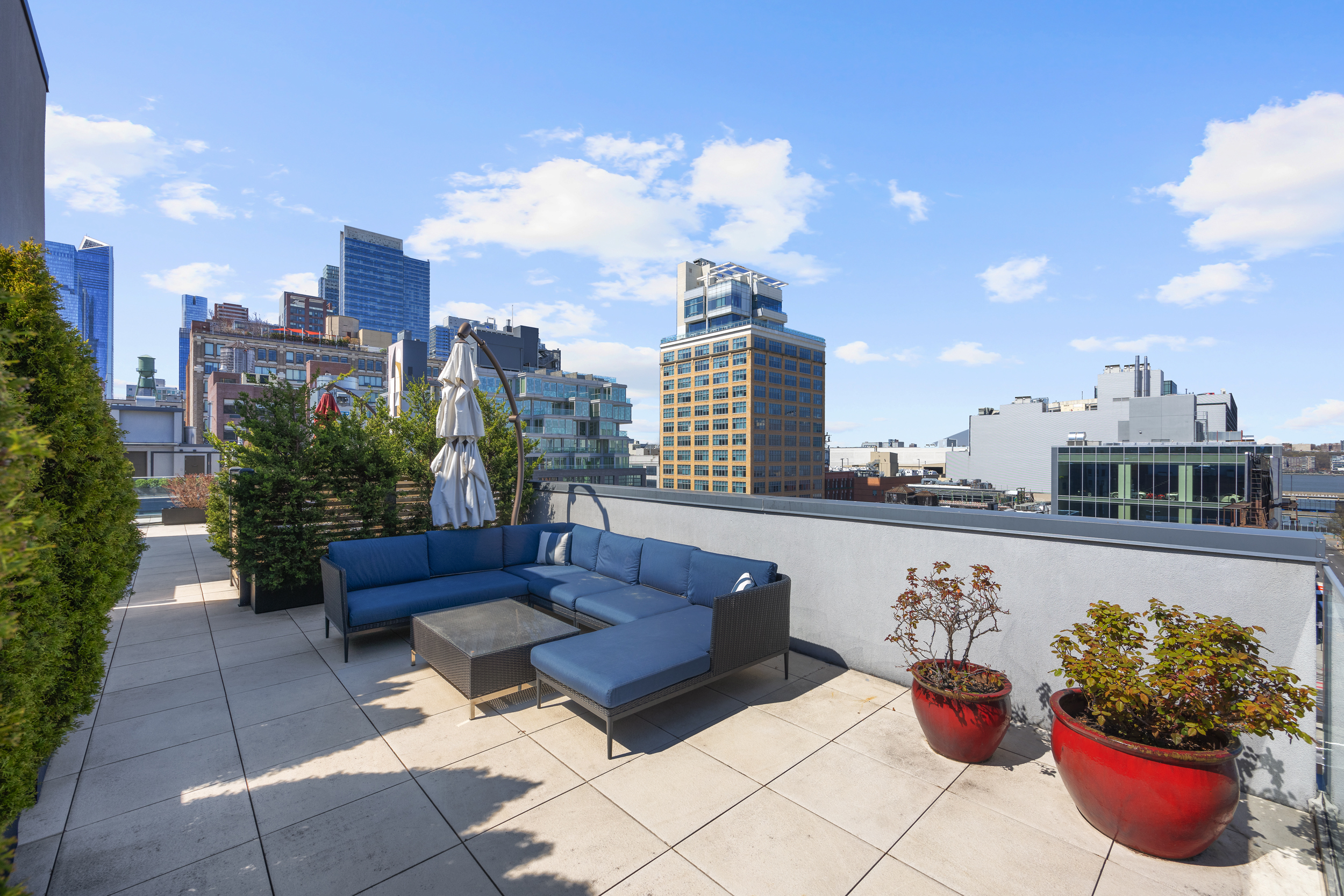 540 West 49th Street, Unit PH1N Manhattan, NY 10019 - Photo 14 of 18 a view of a terrace with furniture and potted plants