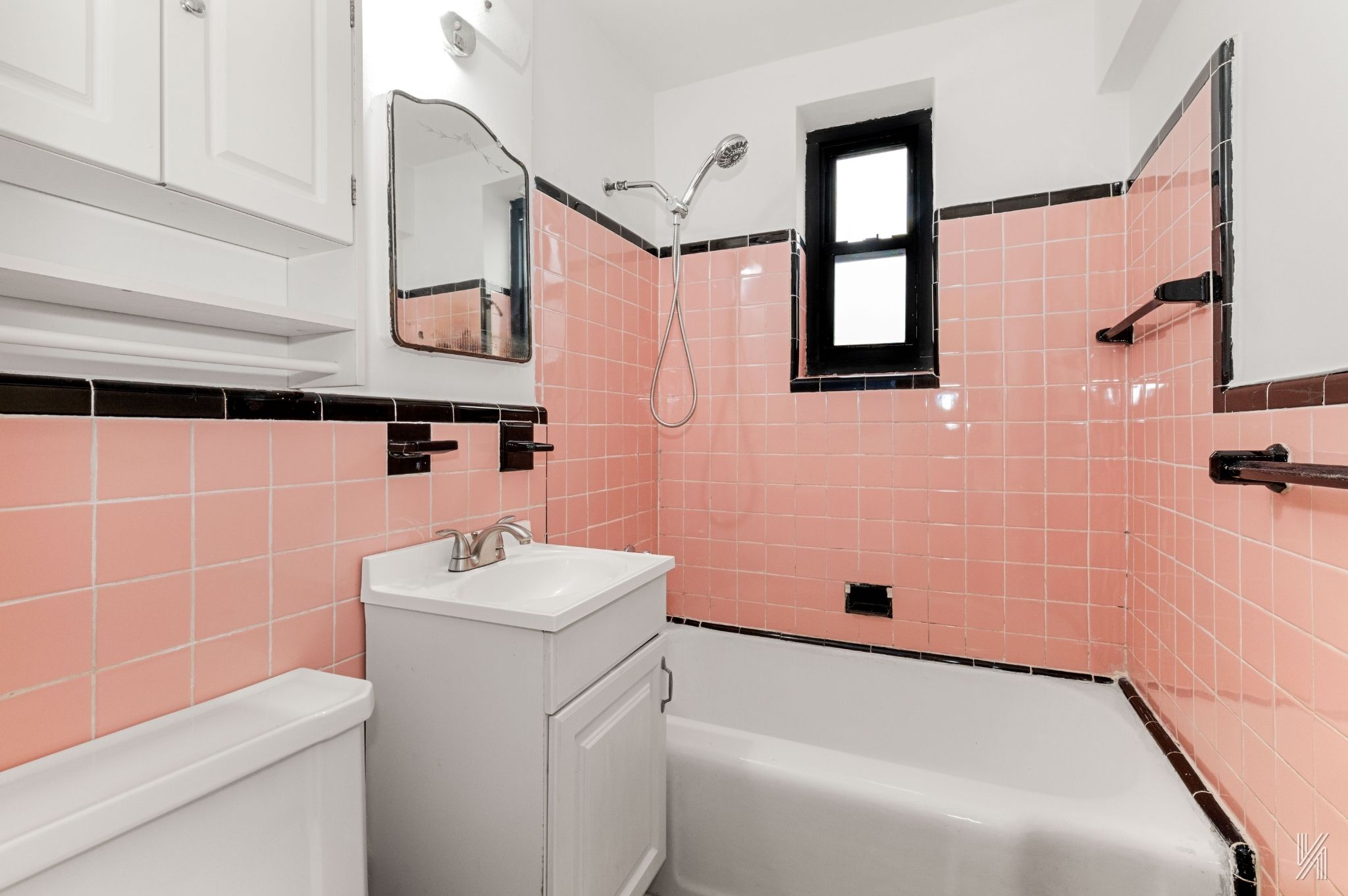 22-60 79th Street, Unit 3E Queens, NY 11370 - Photo 16 of 17 a bathroom with a sink a toilet and shower