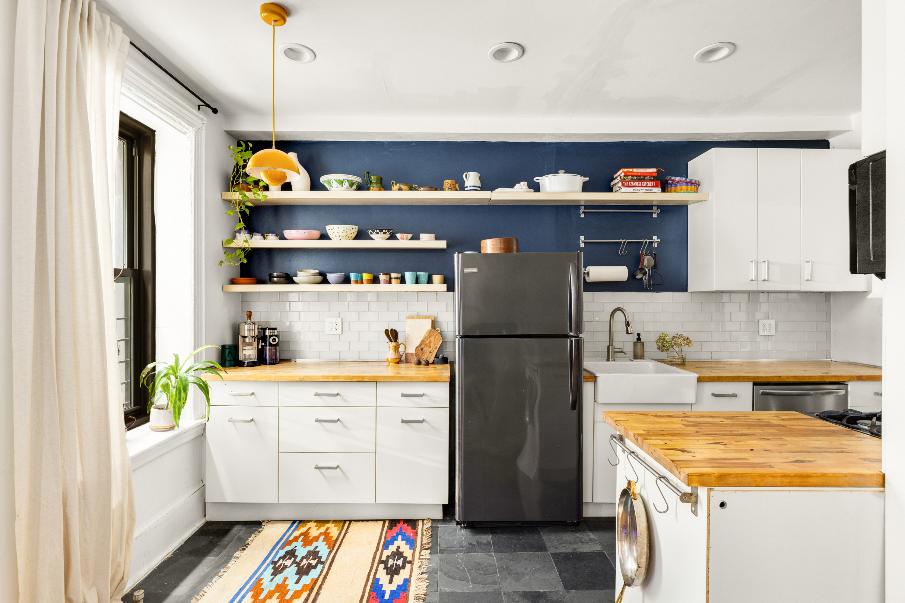 345 Montgomery Street, Unit 1N Brooklyn, NY 11225 - Photo 2 of 7 a kitchen with stainless steel appliances a white refrigerator and a stove top oven